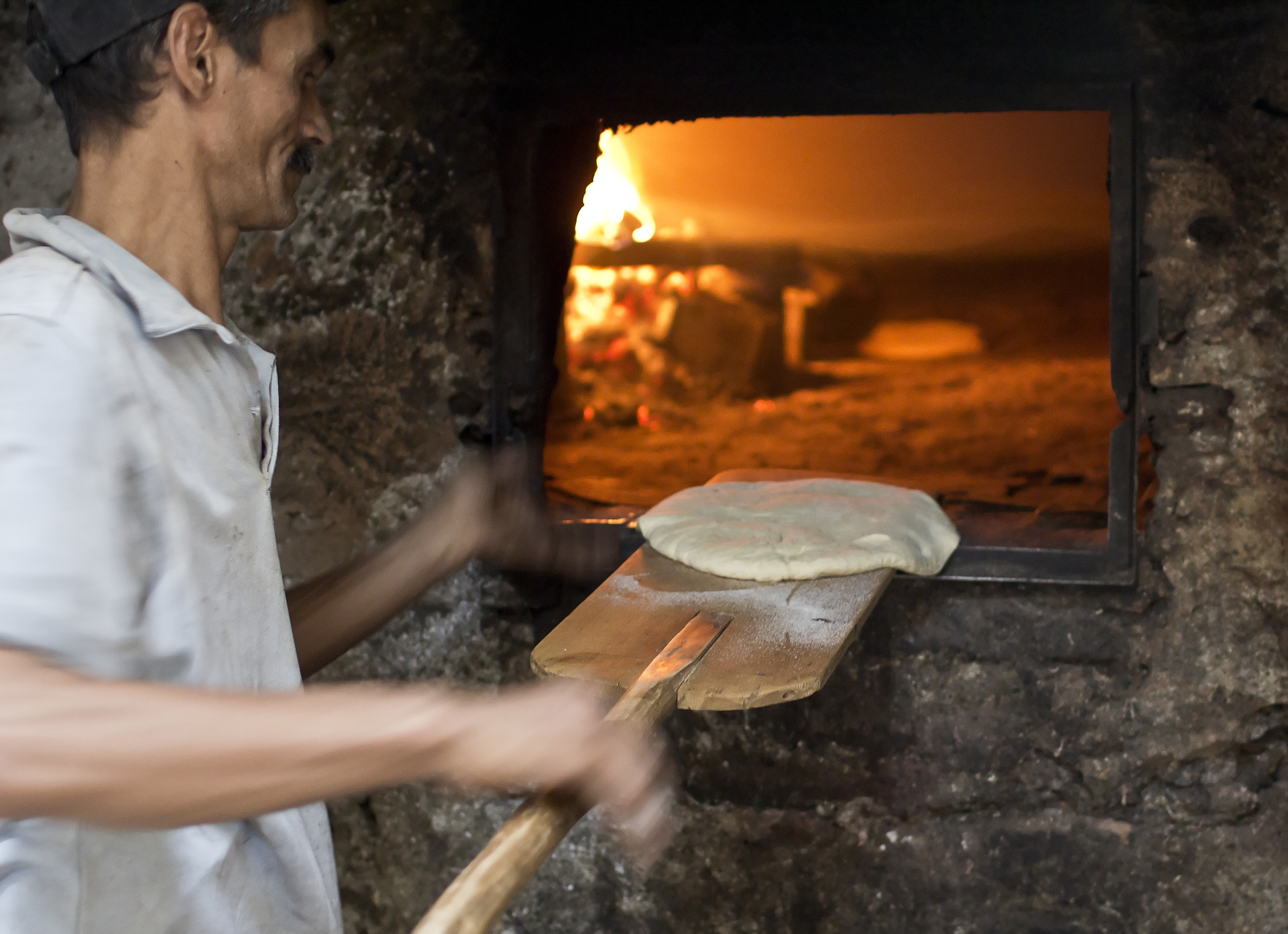 Bread baking in a traditional communal oven