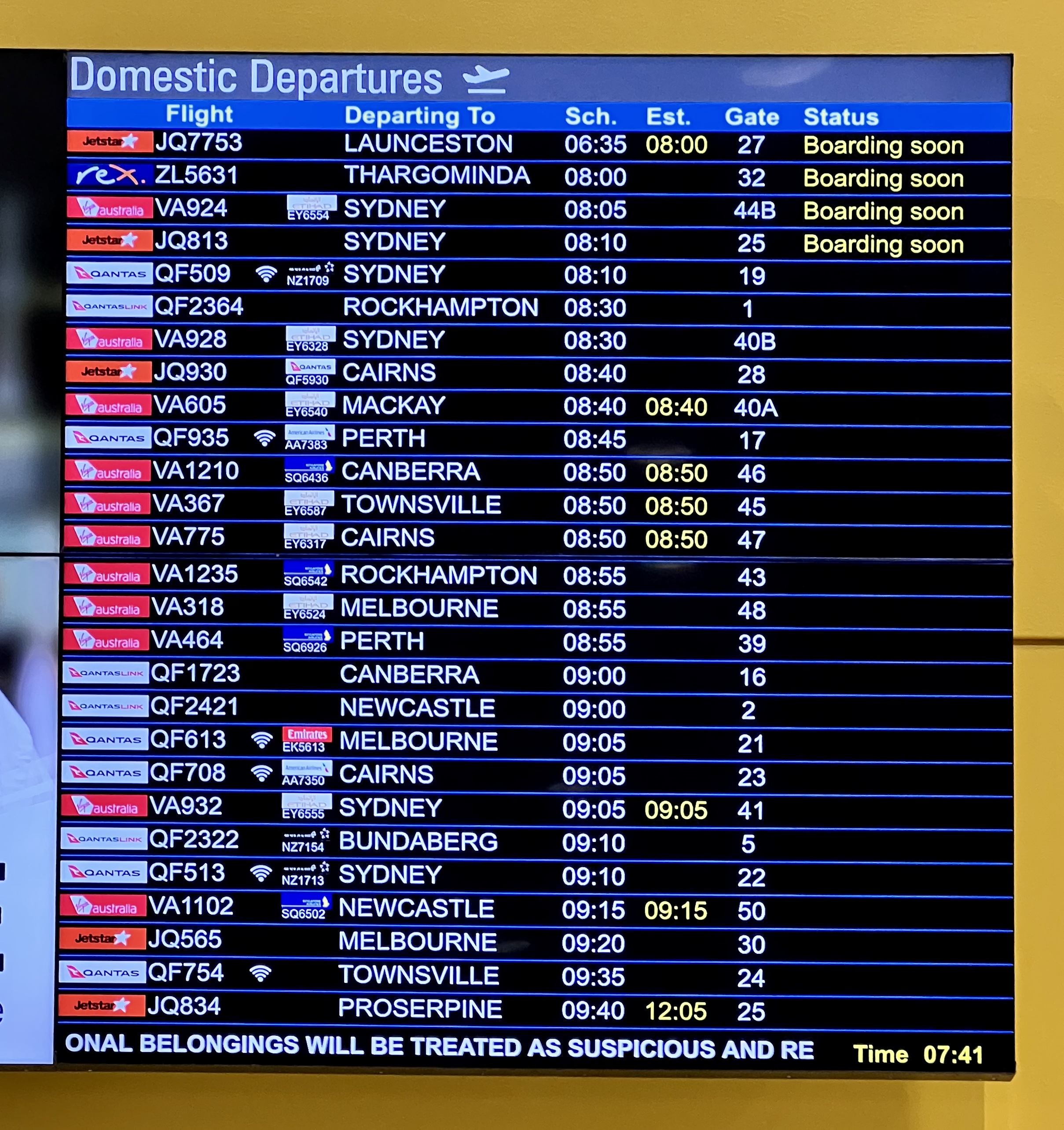 Airport departures board showing multiple flight numbers for the same gates