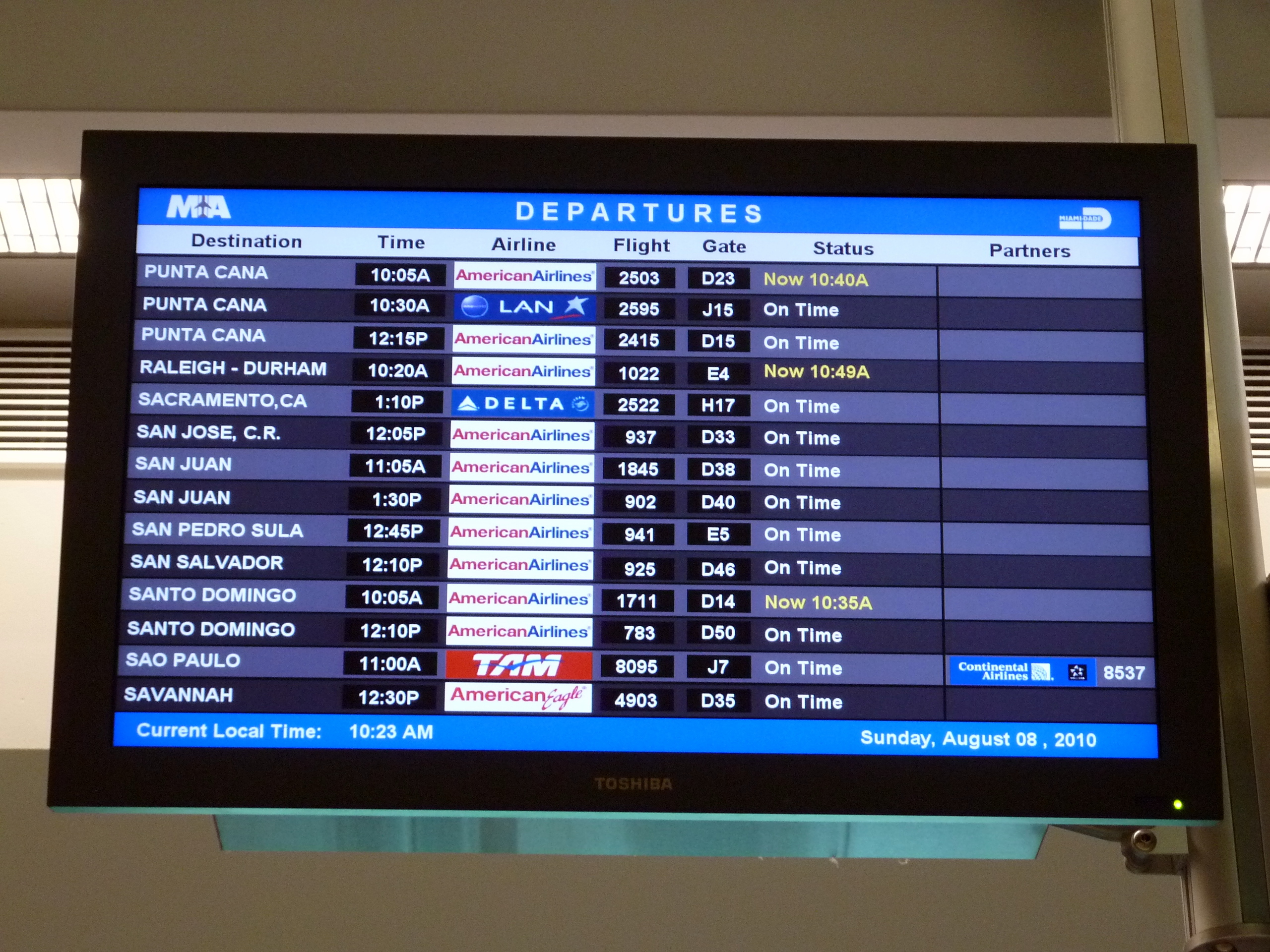 Passengers queuing at airline check-in counters