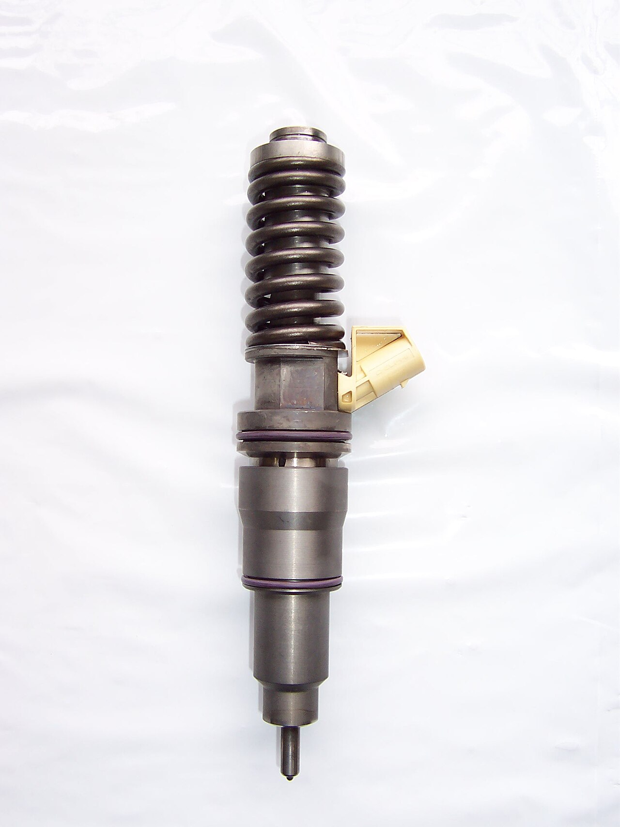 A close-up of a unit injector of the type used in diesel engines