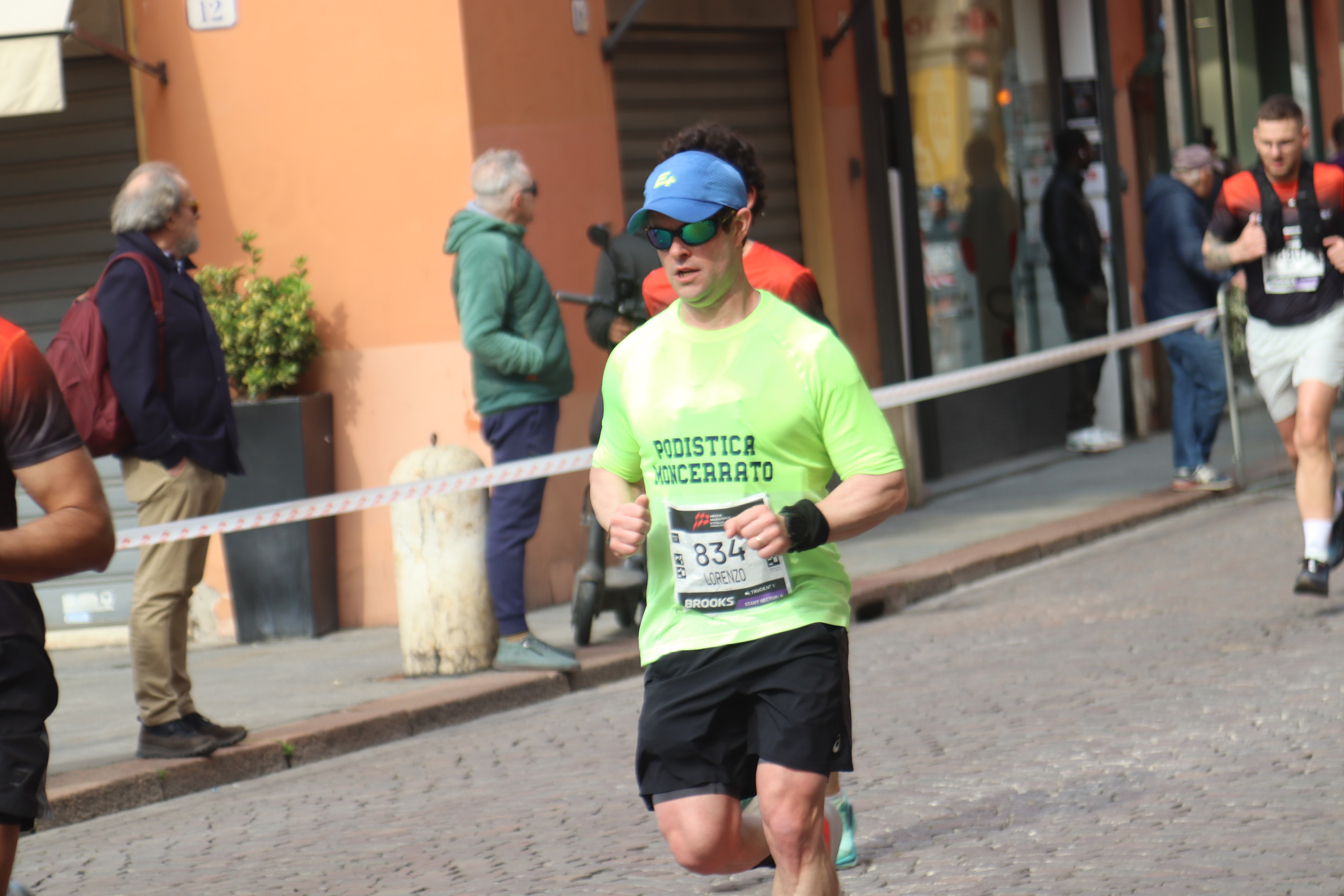 Runners competing in a half marathon in Modena, Italy