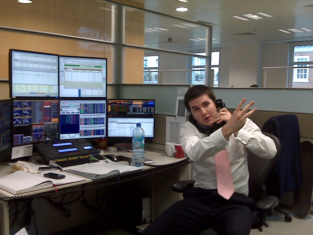 A stockbroker at work in an early trading office