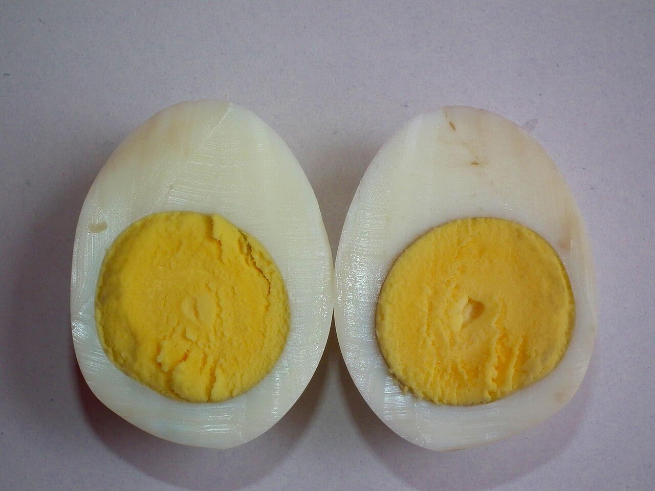 Cross-section of a boiled egg showing white and yolk
