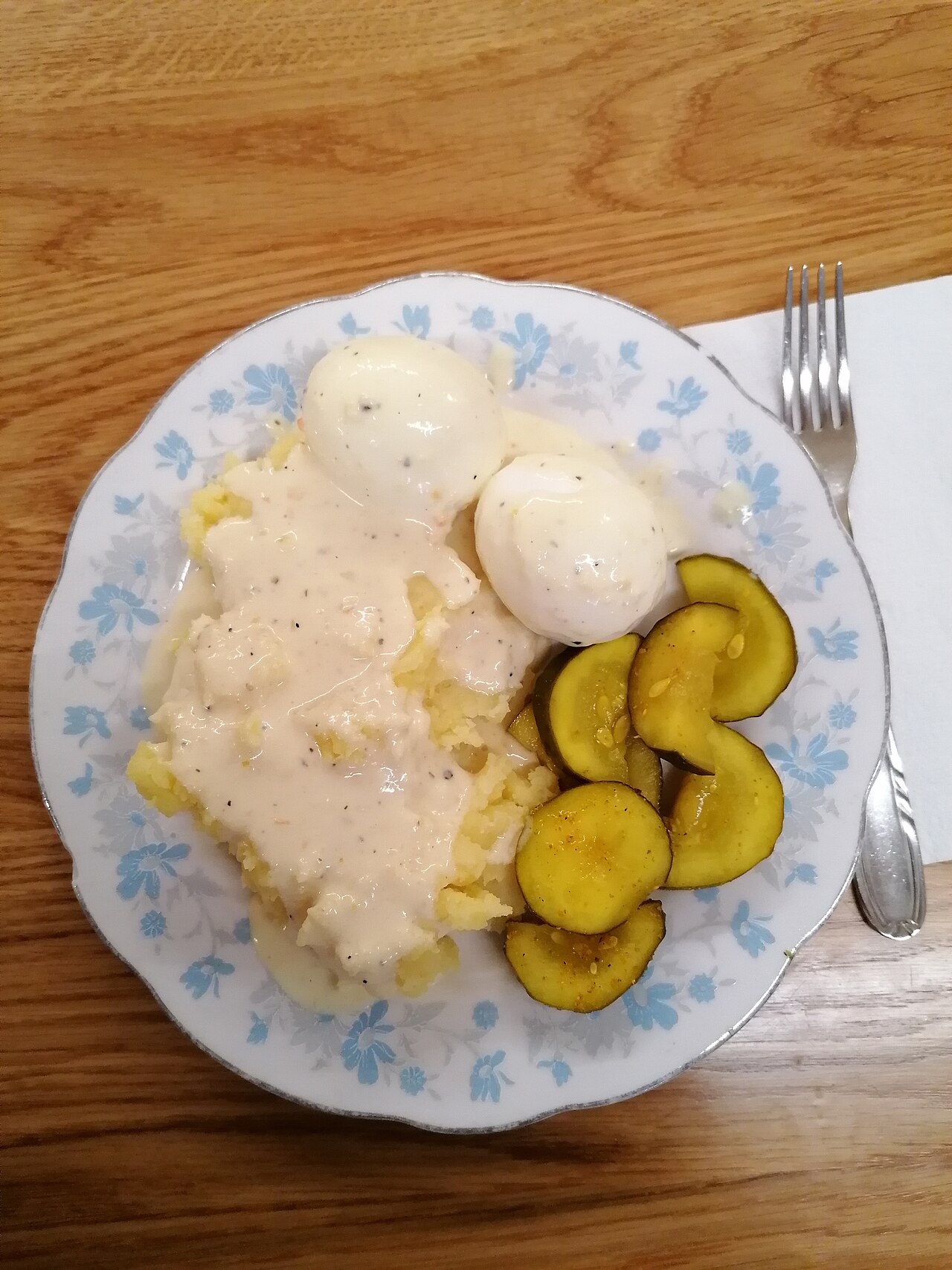 A plated dish of hard-boiled eggs with accompaniments
