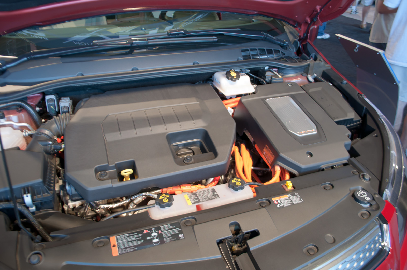 An engine bay with battery and charging components