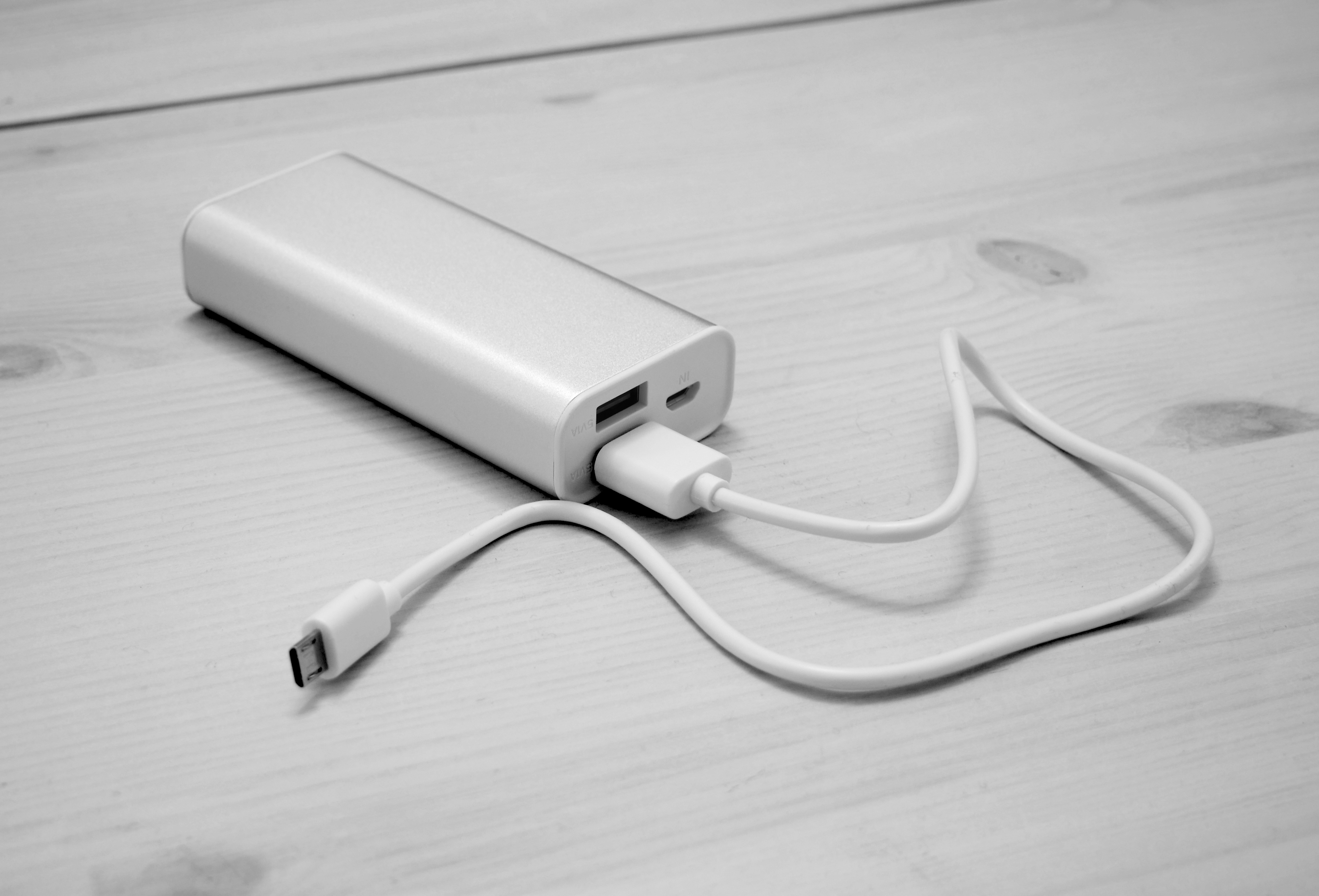 Portable power bank device on a surface