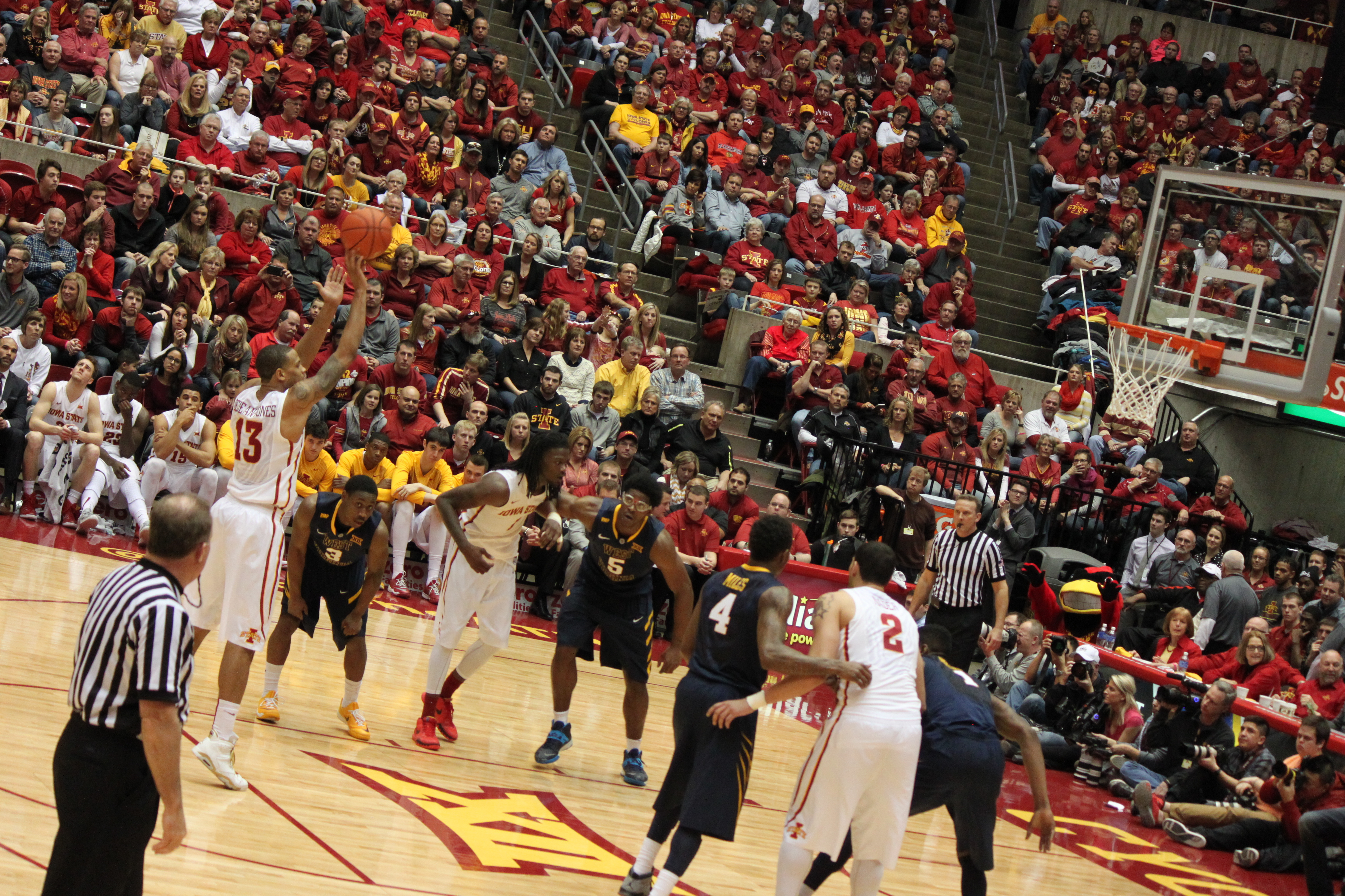 Basketball player shooting toward the hoop during a game