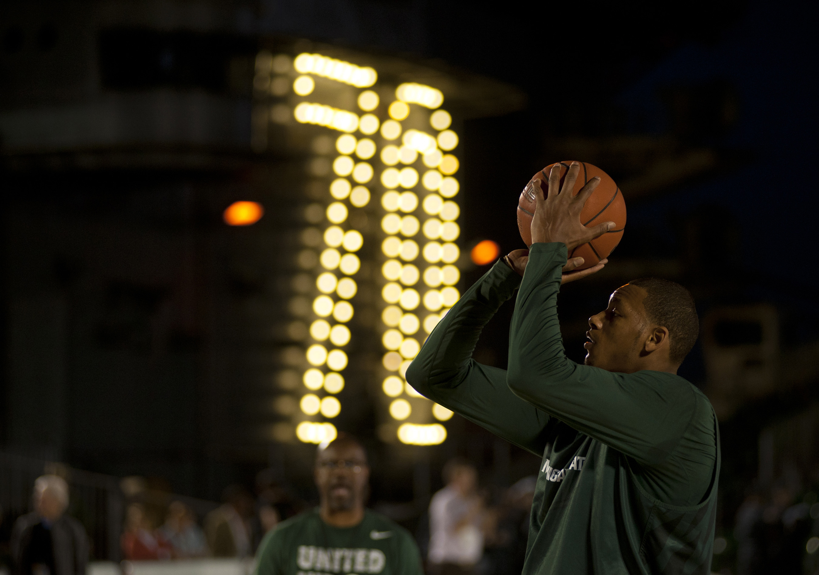 Basketball player shooting during practice