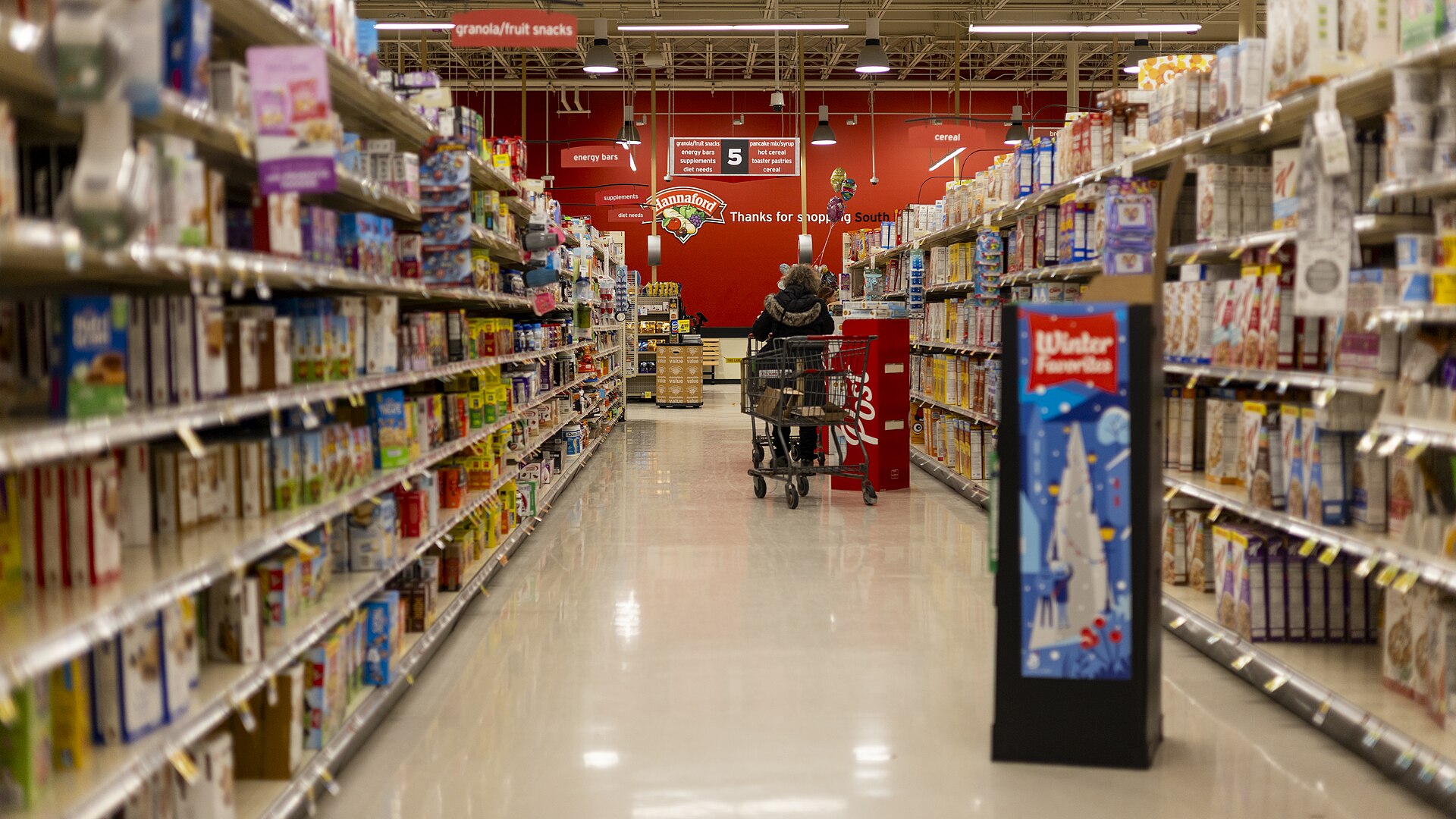 Grocery store aisle stocked with products
