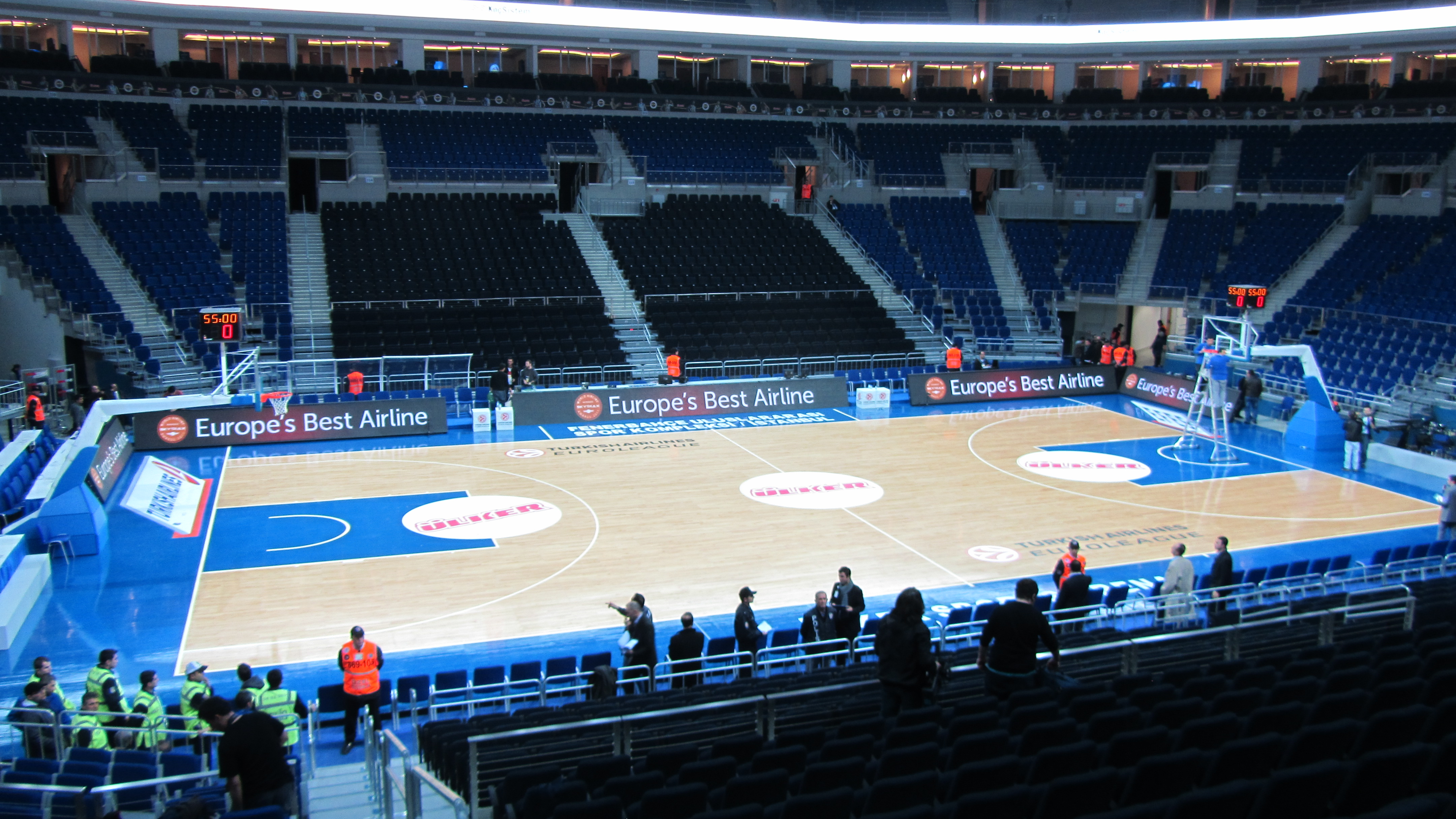 A basketball court inside a European arena during a game