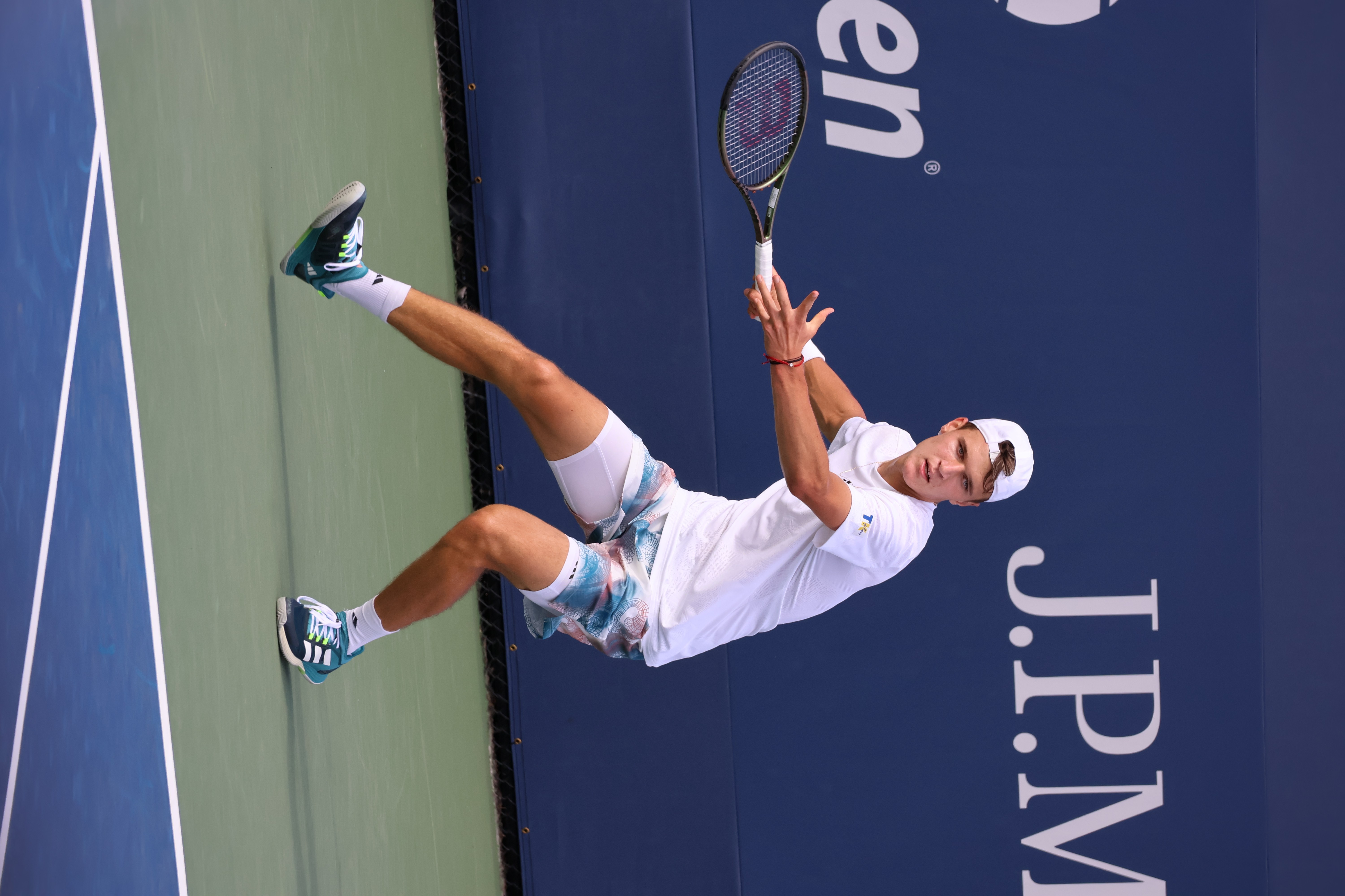 Jakub Mensik serving during a match at the US Open
