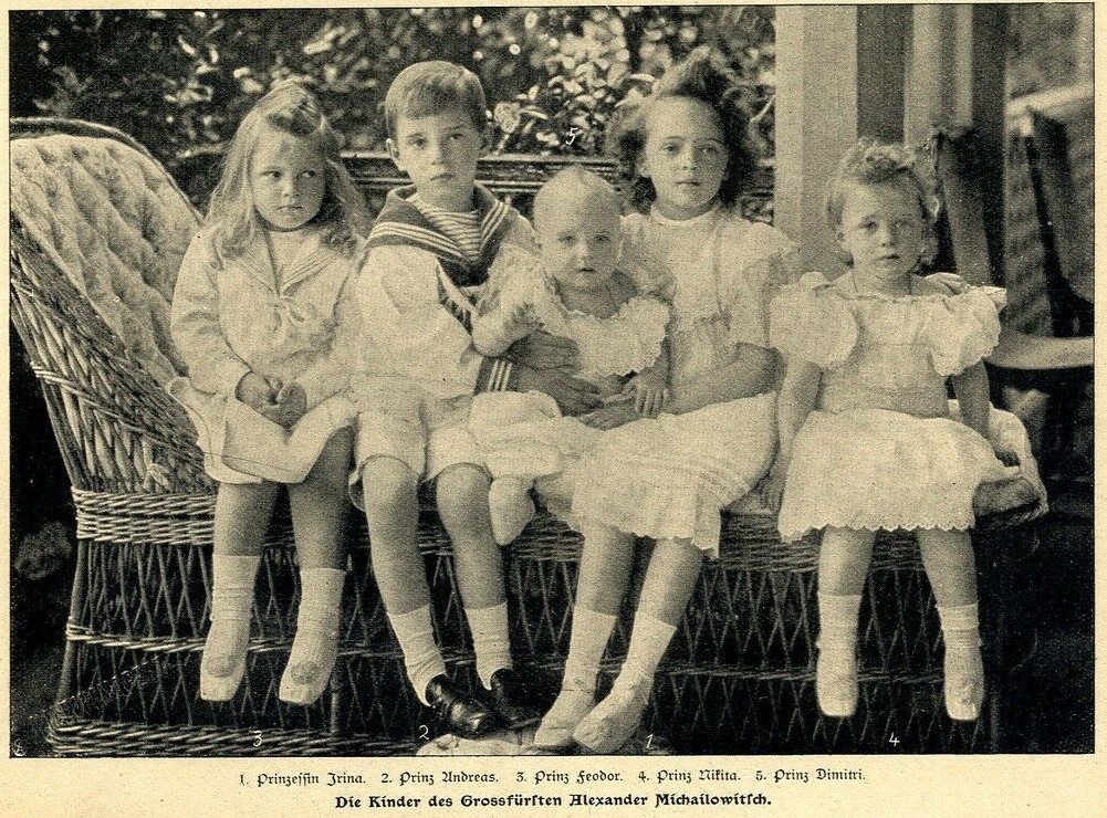 Five siblings photographed together in 1903, the older girl seated among younger children
