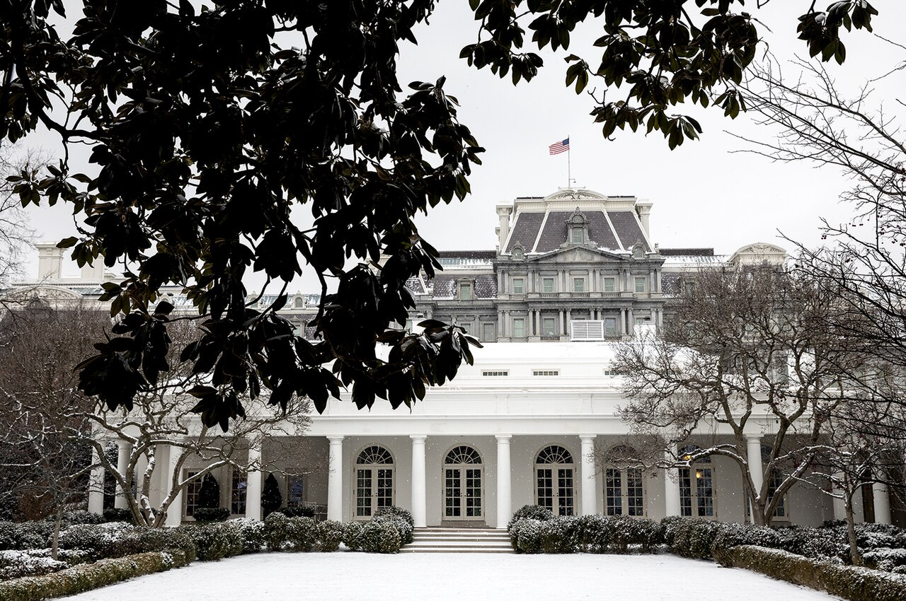 A house dusted with snow in winter