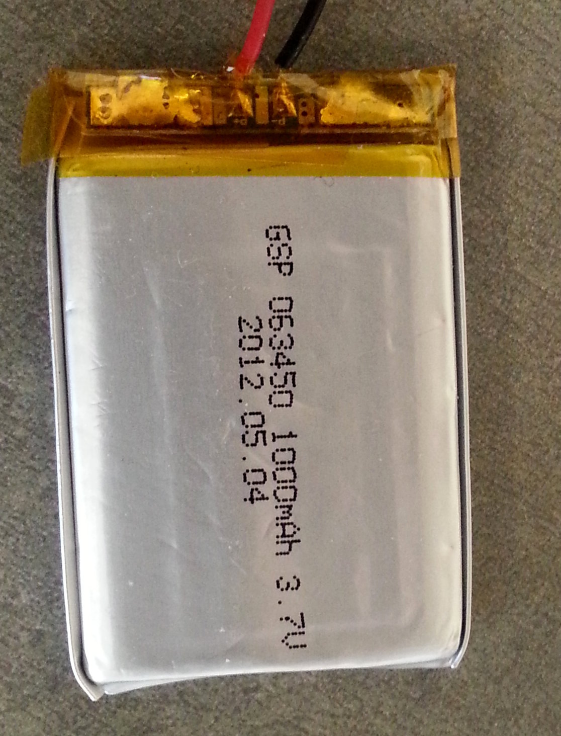 A lithium polymer phone battery cell, the chemistry that ages even when idle