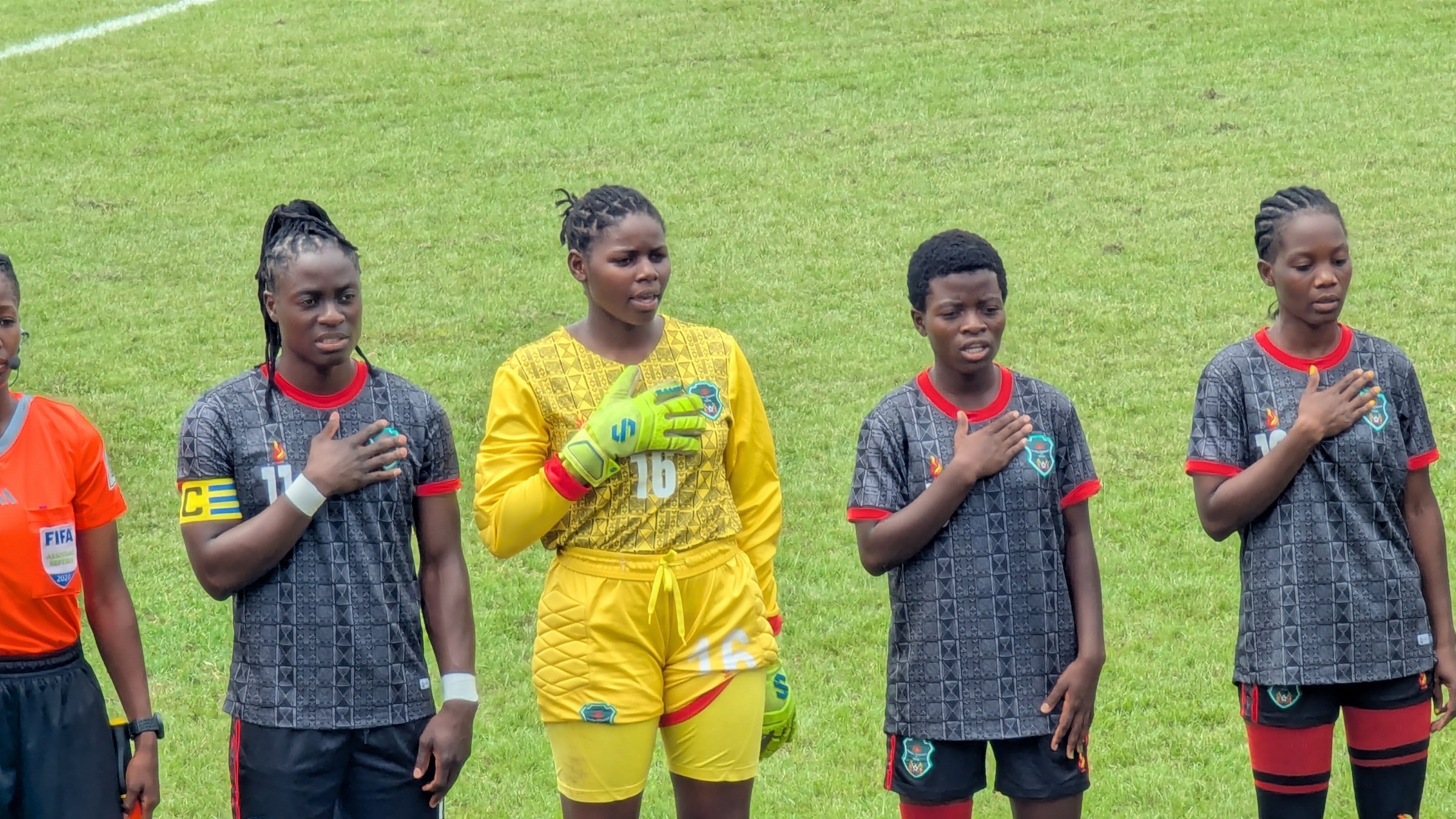 Women's football players contest the ball