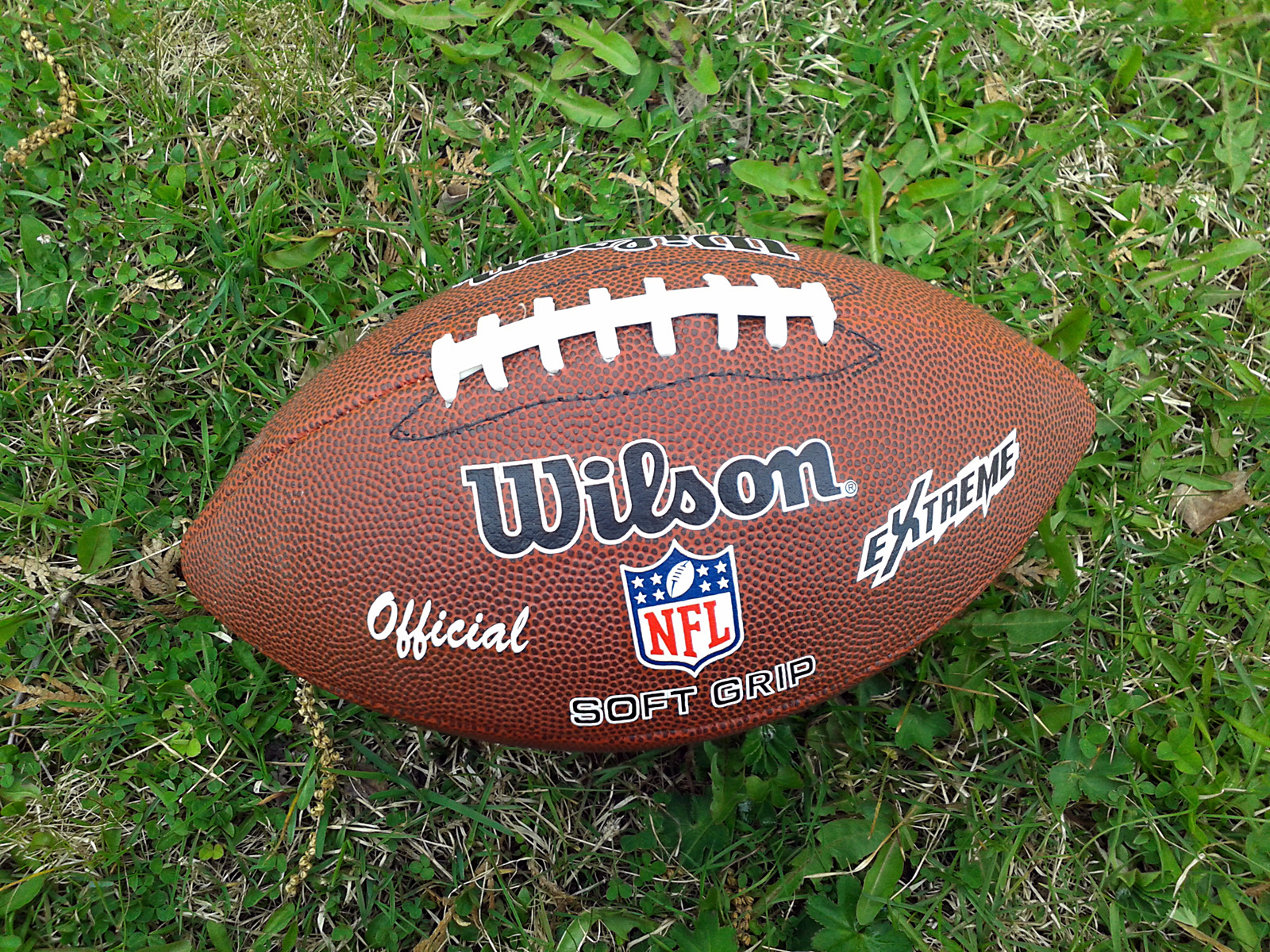 An American football on the ground