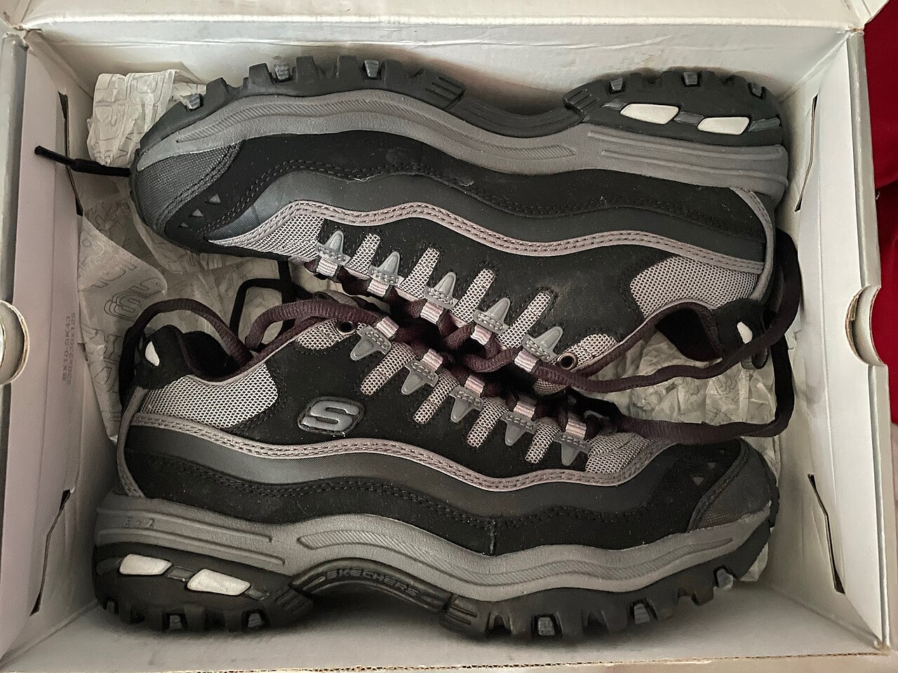 A running shoe showing its profile and cushioning stack height