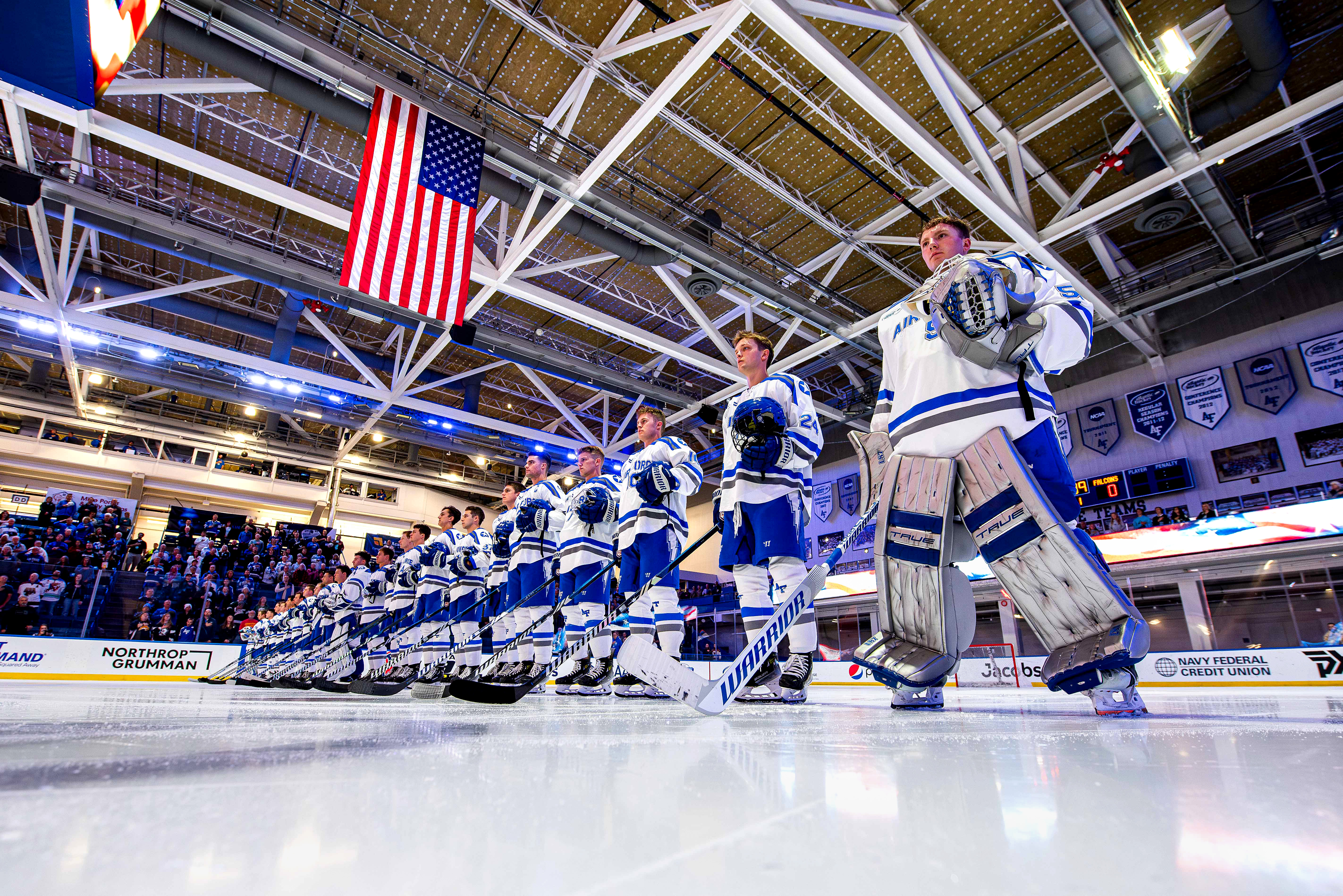Hockey players competing on the ice during a game