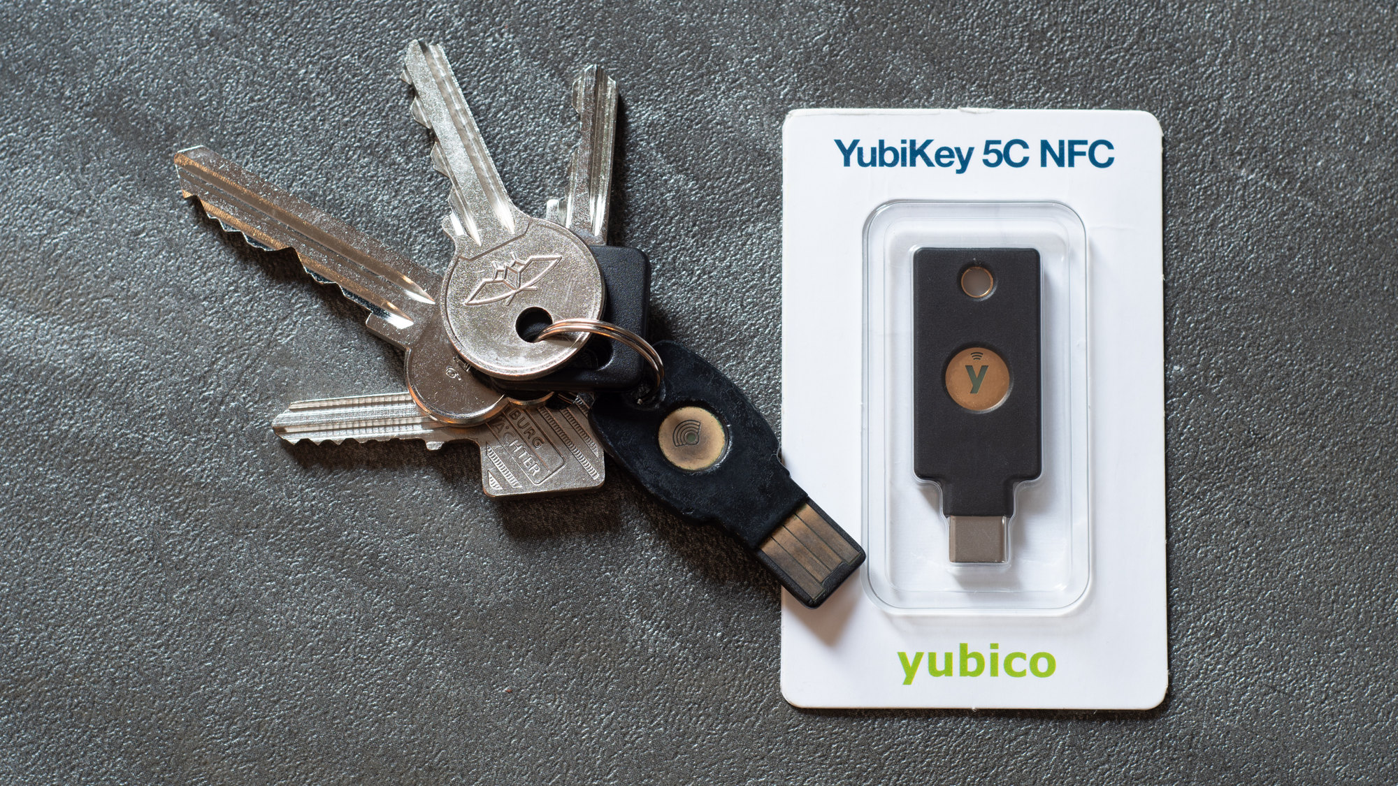 A YubiKey 5C NFC hardware security key, one of the original FIDO authenticators that passkeys are built on
