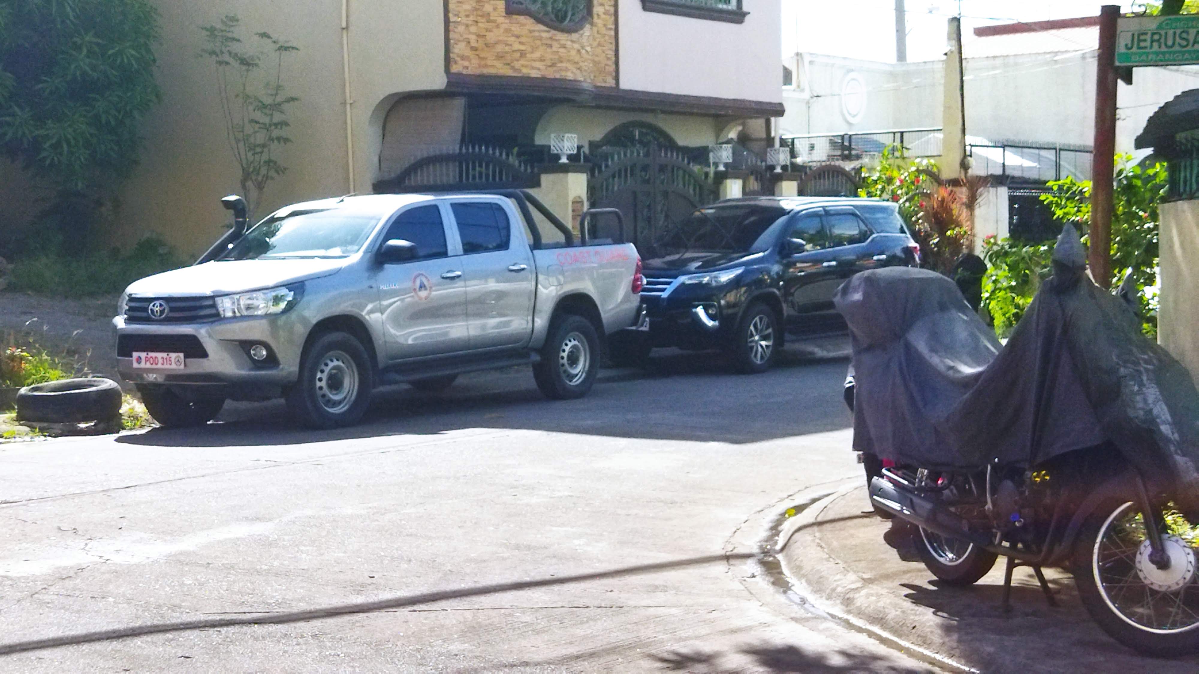 A white Toyota HiLux pickup parked outdoors
