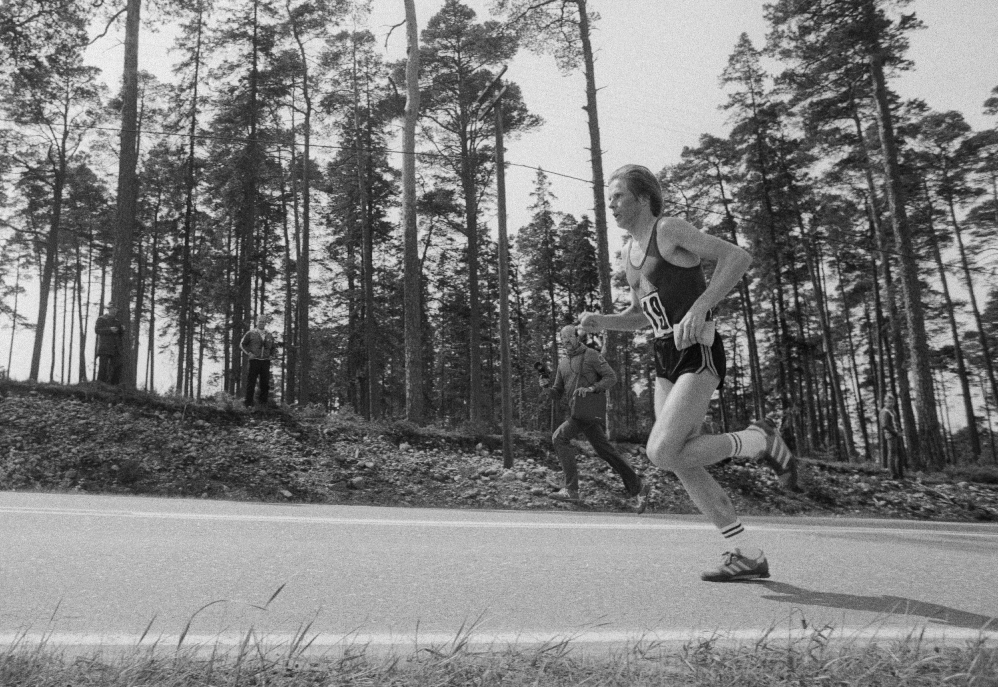 Marathon runners competing on a city road