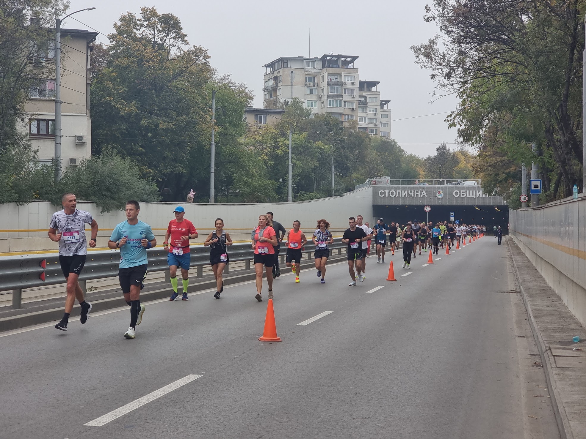 Runners emerging from a road tunnel during the 2024 Sofia Marathon