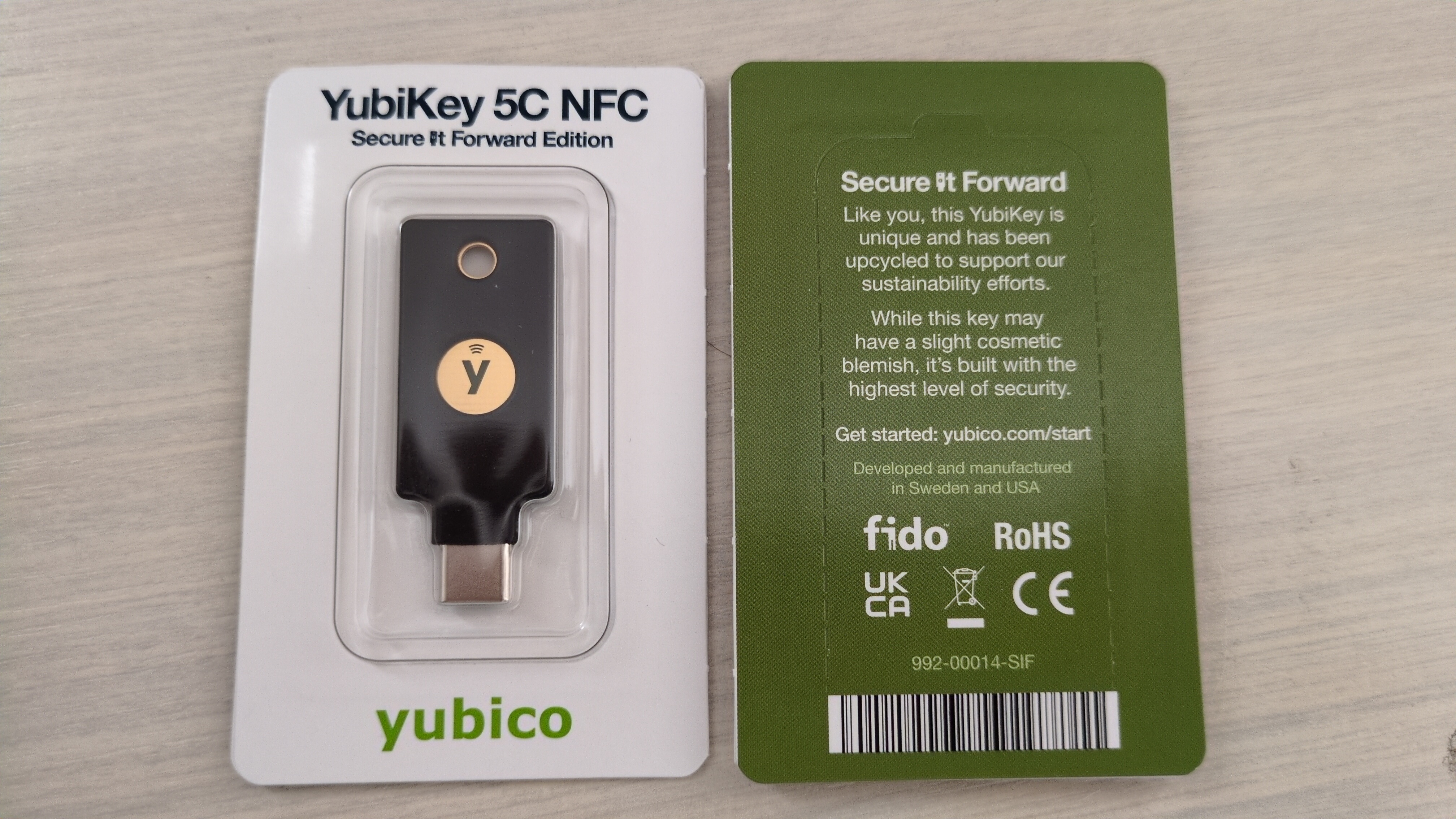 A YubiKey 5C NFC security key in its packaging, an example of a roaming authenticator used with WebAuthn