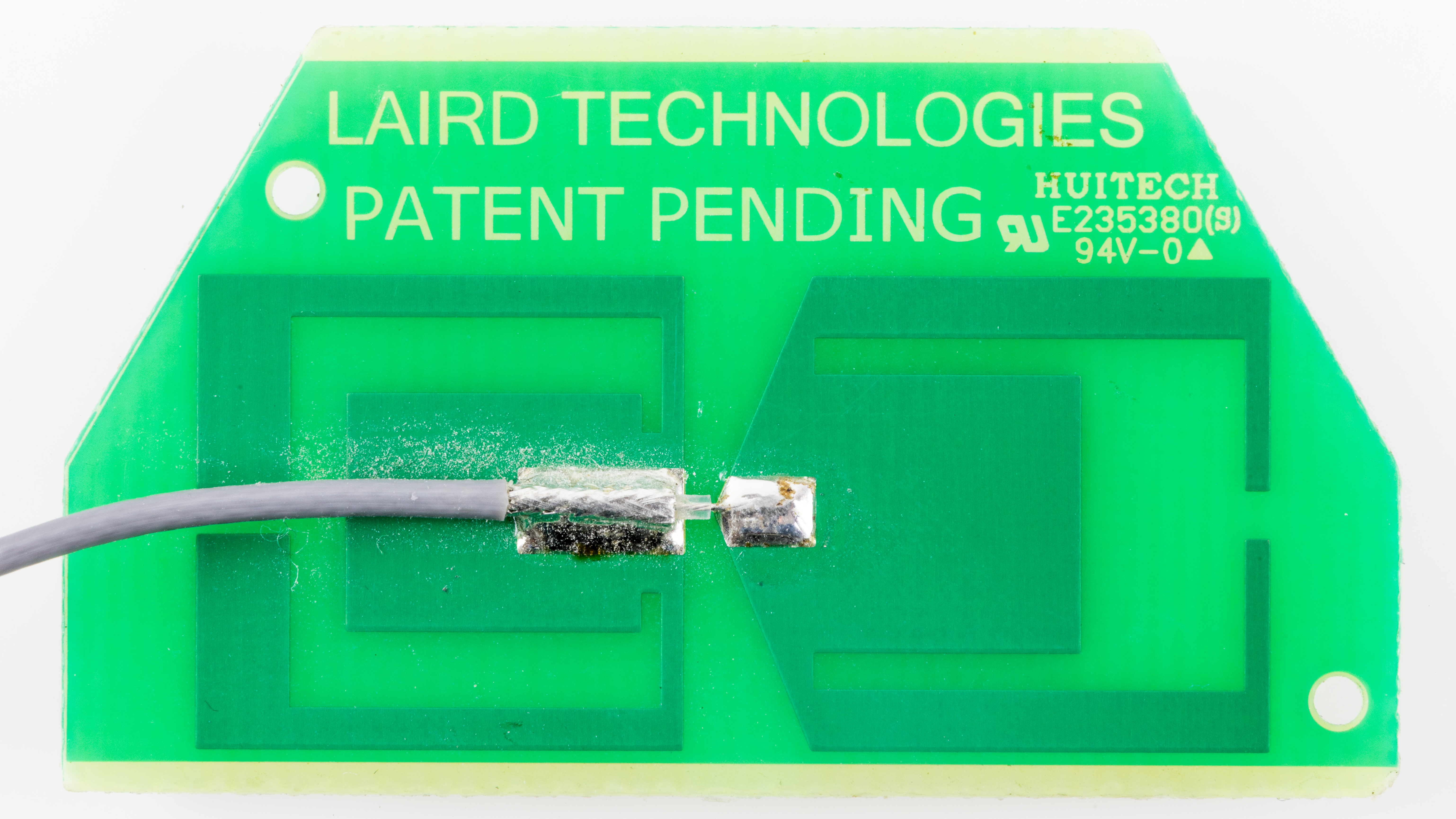 Close-up of a home router's external Wi-Fi antennas, which broadcast the 2.4, 5, and 6 GHz bands