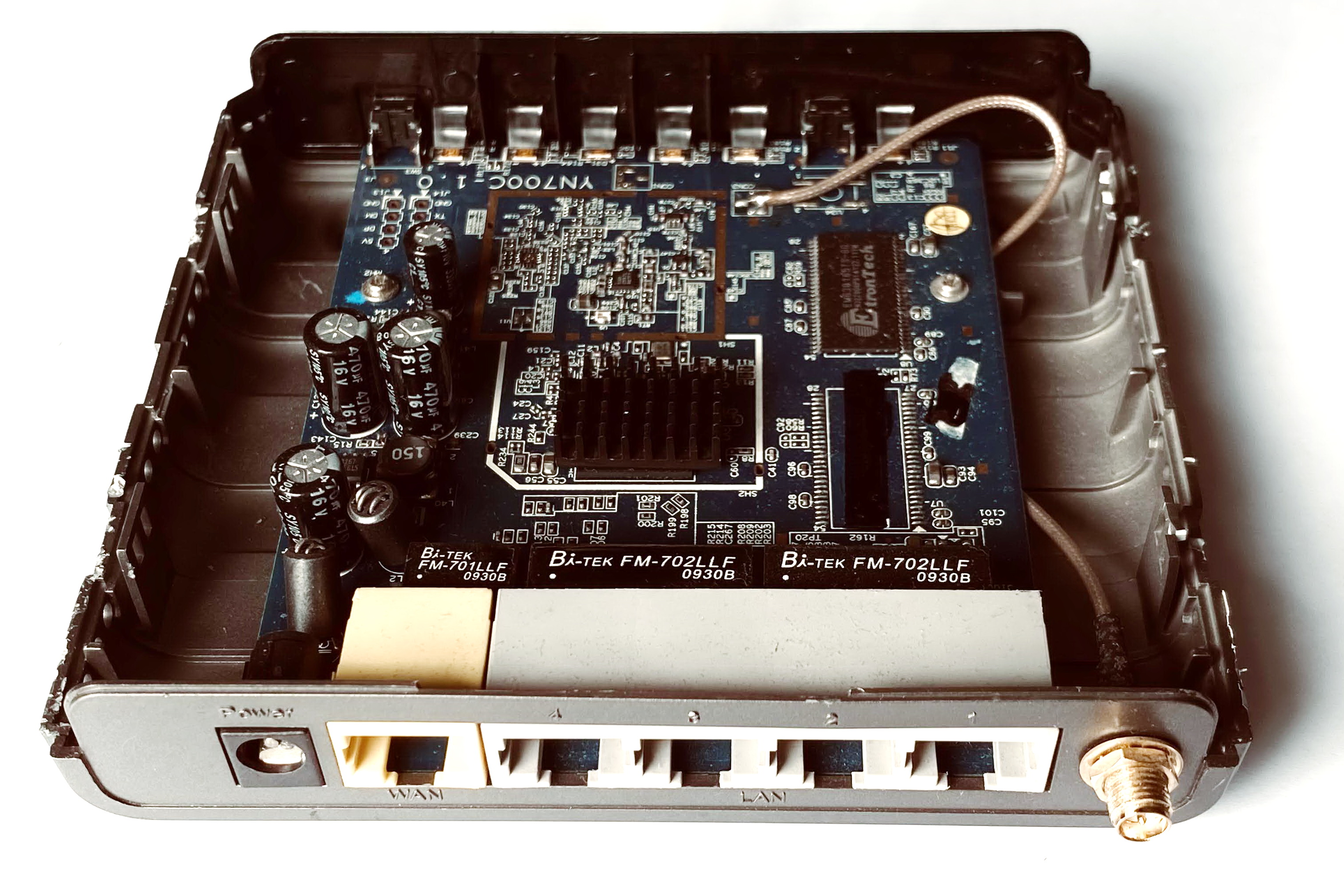 The internal components of a wireless router, showing the radios and processors inside the plastic shell