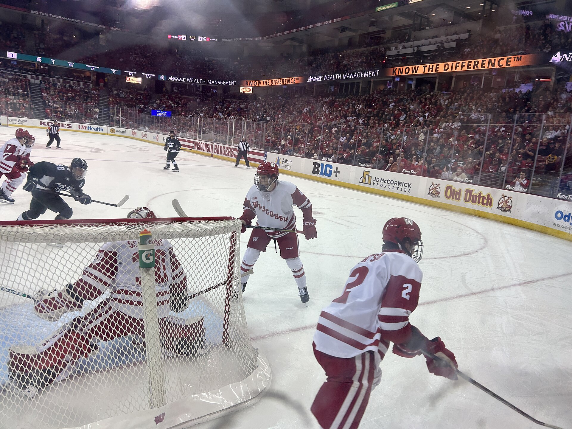 Ice hockey players compete during a game