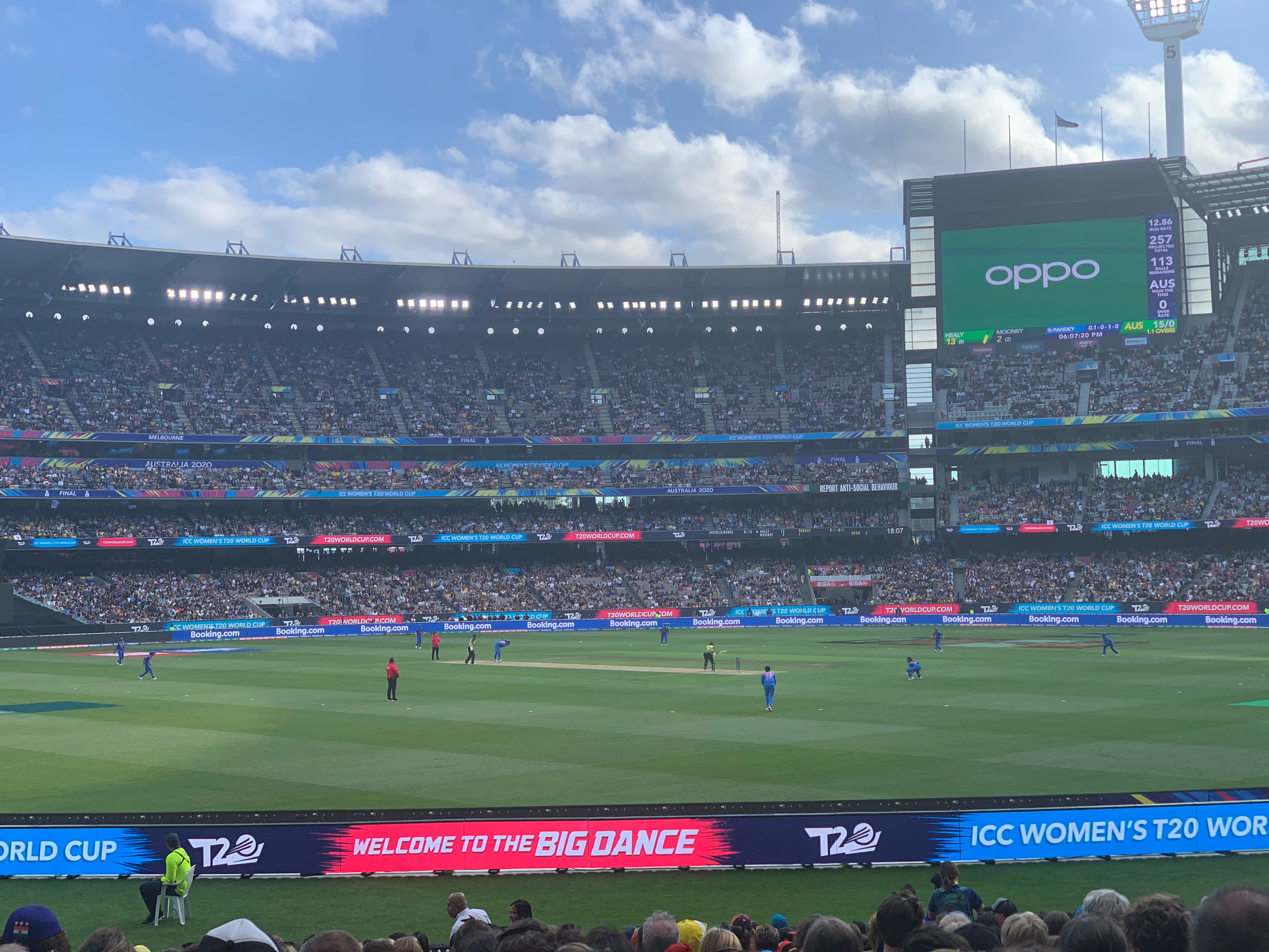 Women's cricket match in a packed stadium