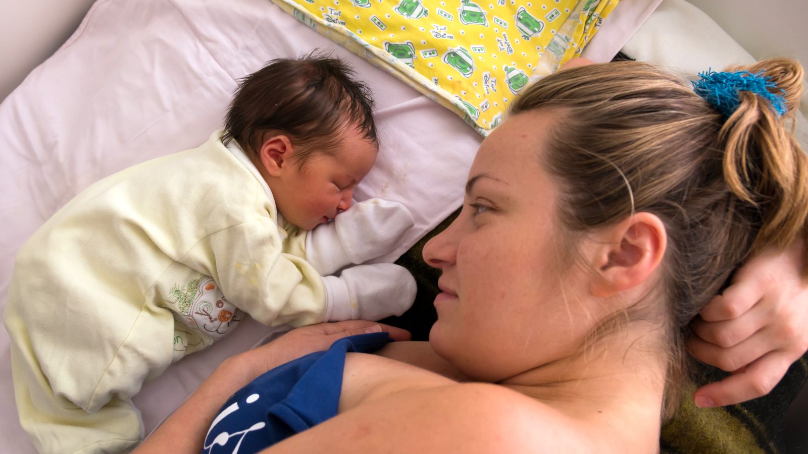 A mother holding her newborn baby