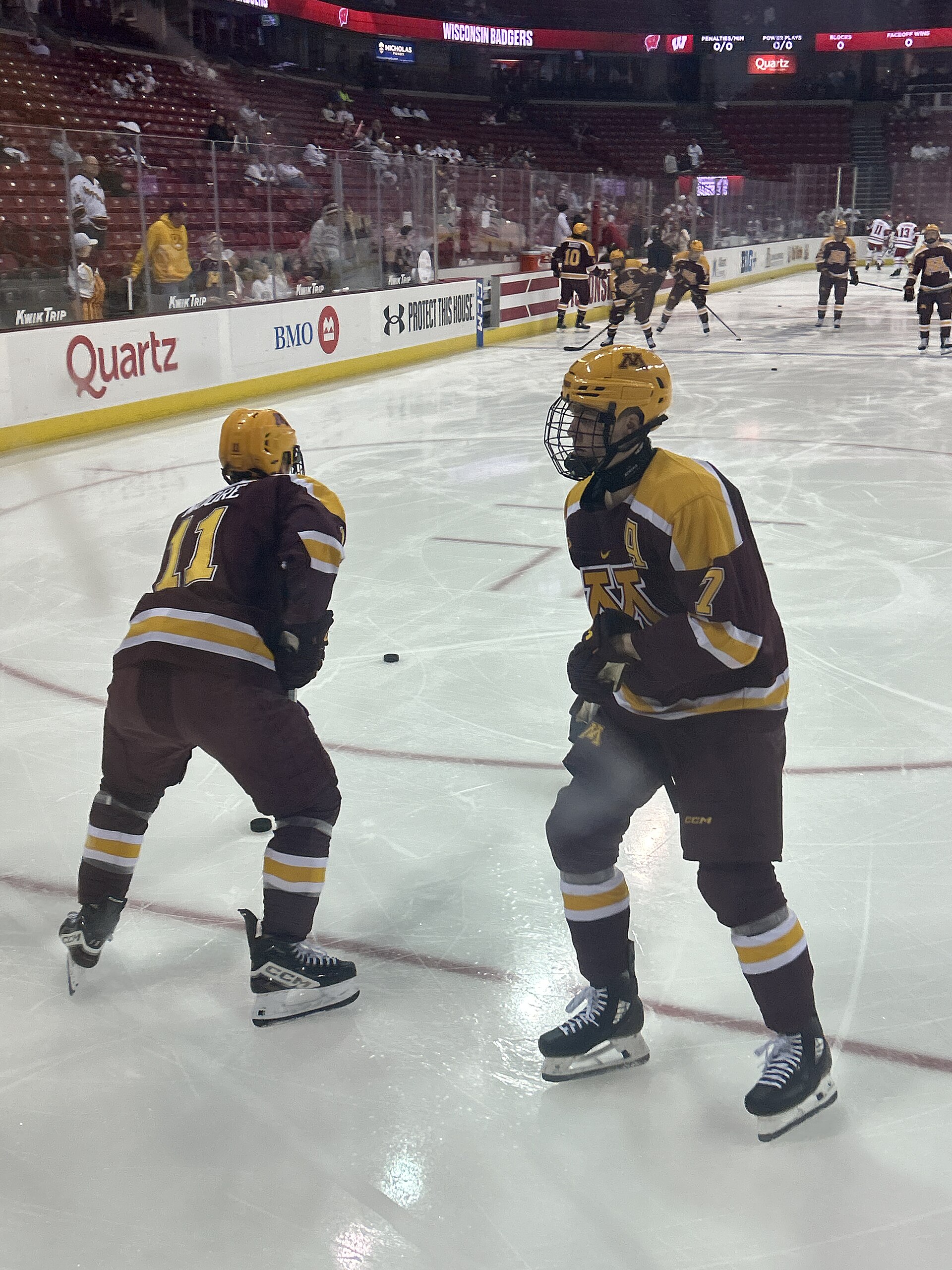 Ice hockey players compete during a game