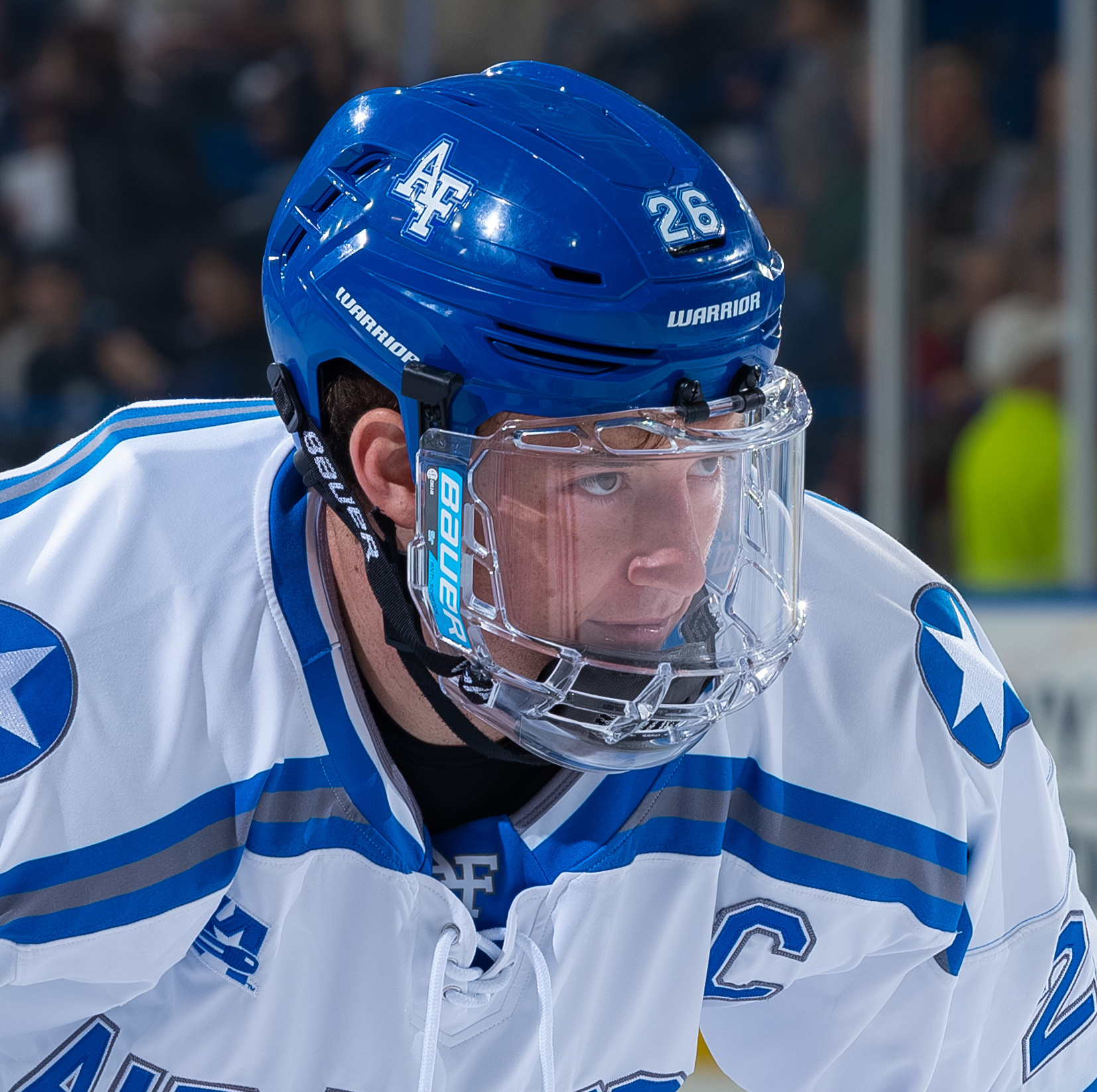 Ice hockey players face off during a game