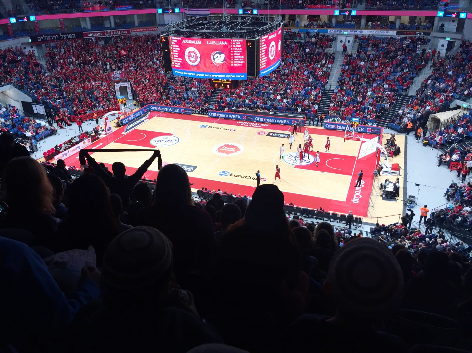 A basketball game in a packed arena