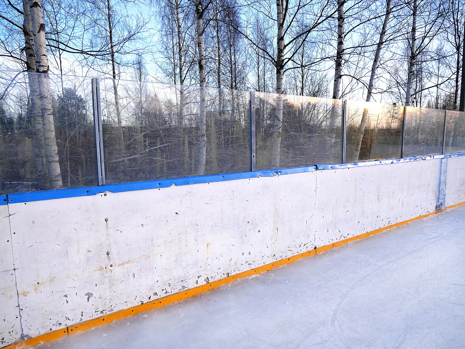 The boards around an ice hockey rink