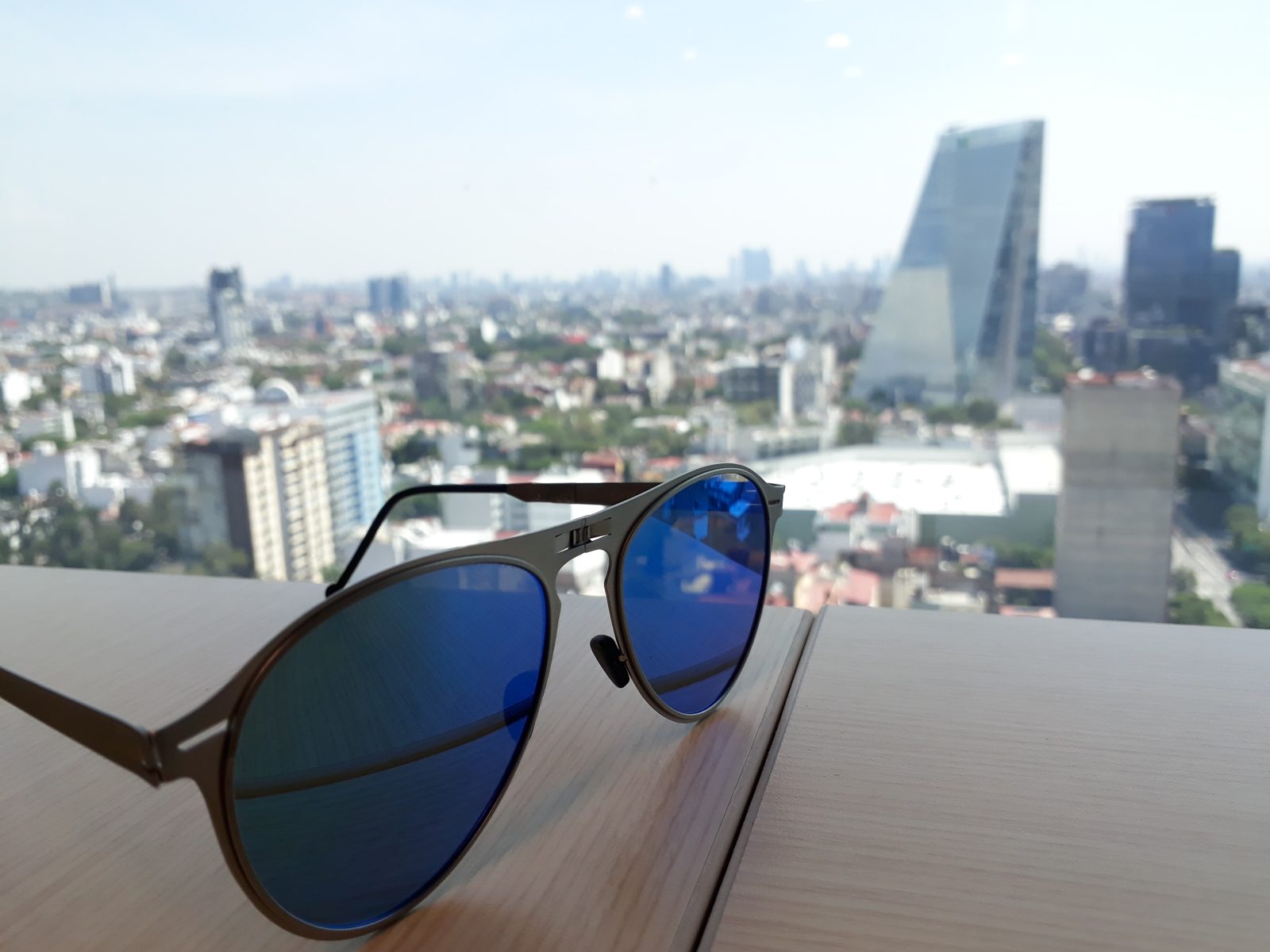 Sunglasses resting on a table in bright sunlight in Mexico