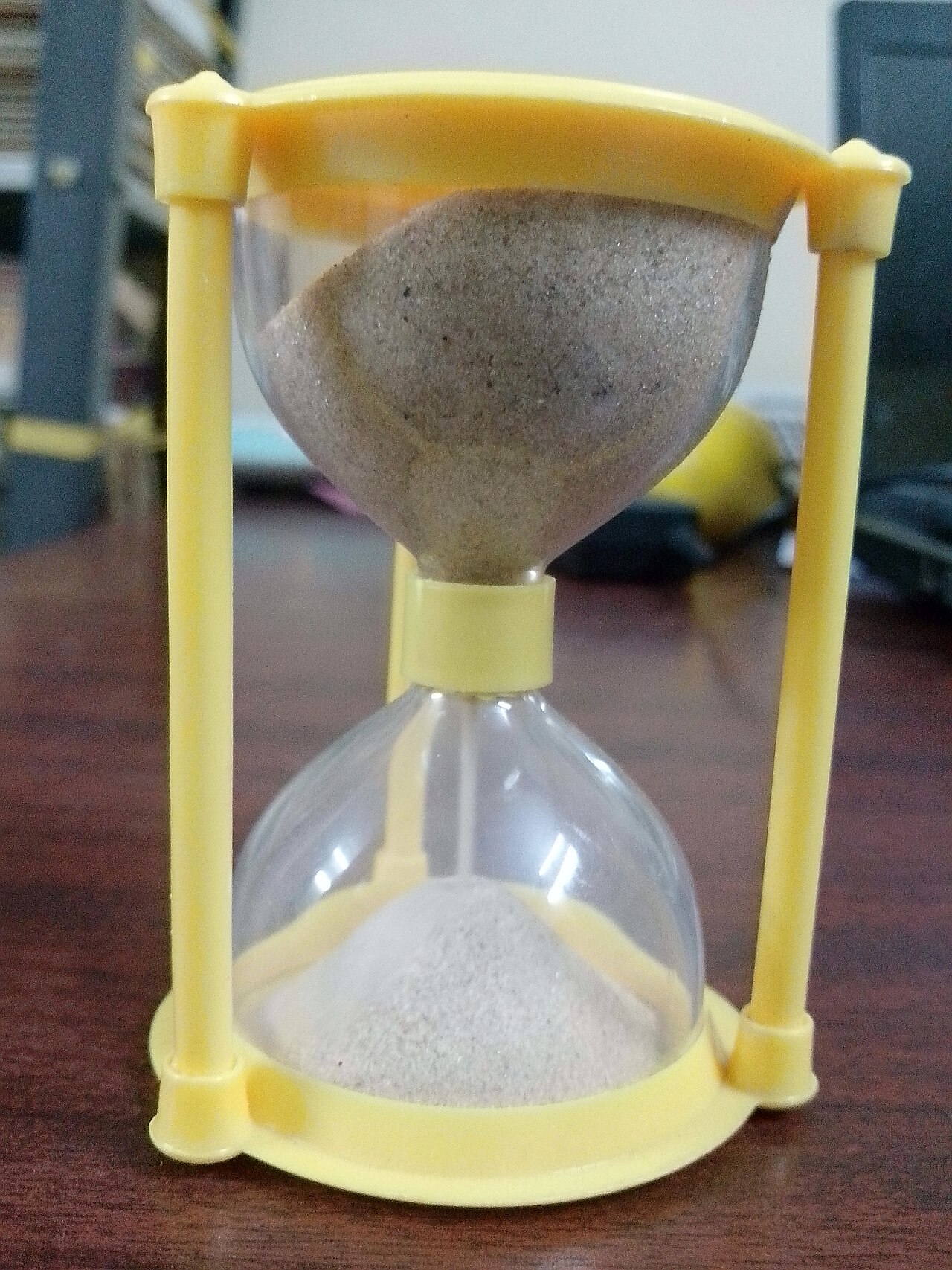 A sand clock with sand running through it