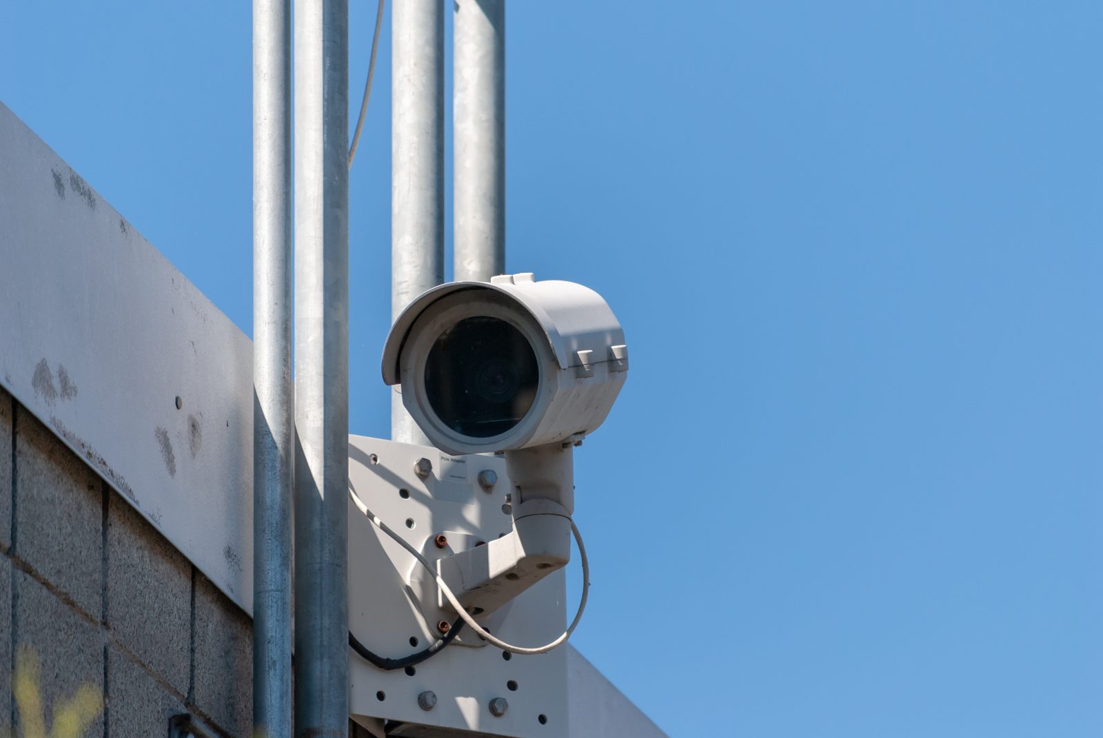A security camera mounted on the side of a building