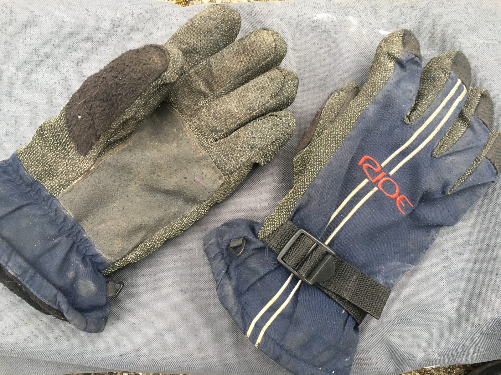 A snowboard glove with a reinforced palm, designed to protect hands during falls