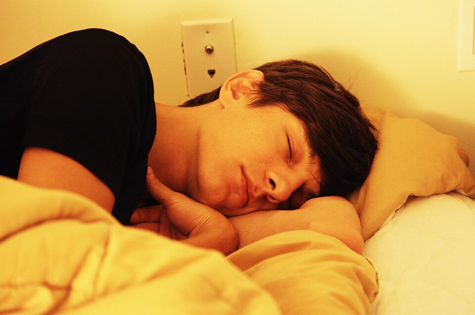 A person sleeping on a pillow, the position that presses sleep lines into the face