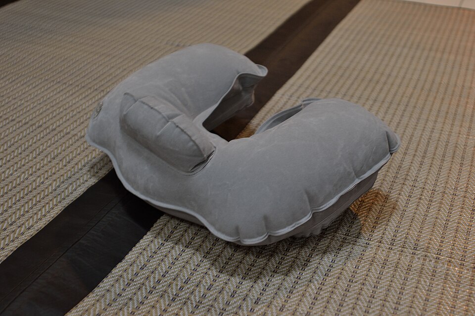 A travel pillow, whose shape changes how pressure reaches the face