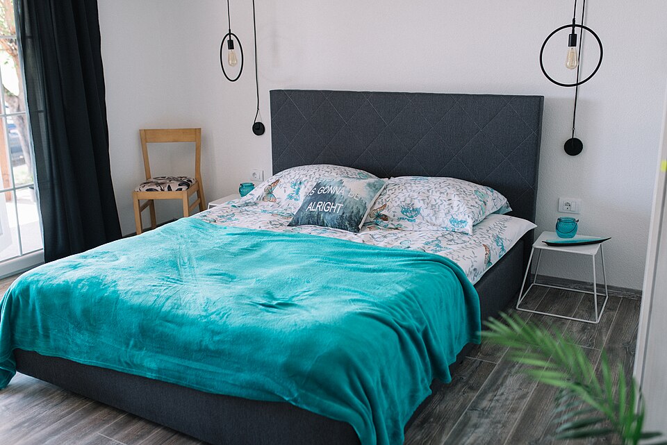 A bedroom with a large bed, where the night of sleep happened