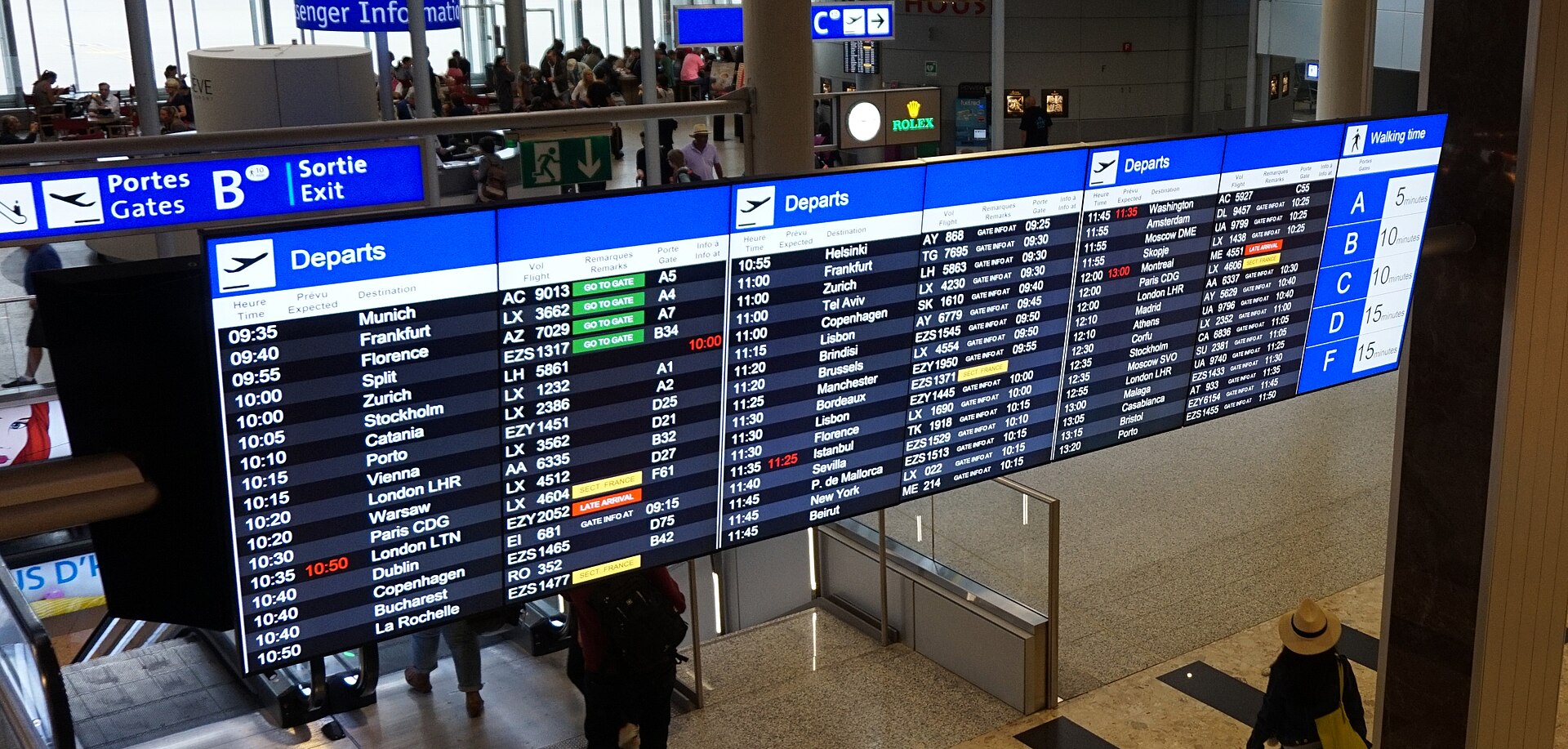 A departure board listing connecting flights in an airport terminal