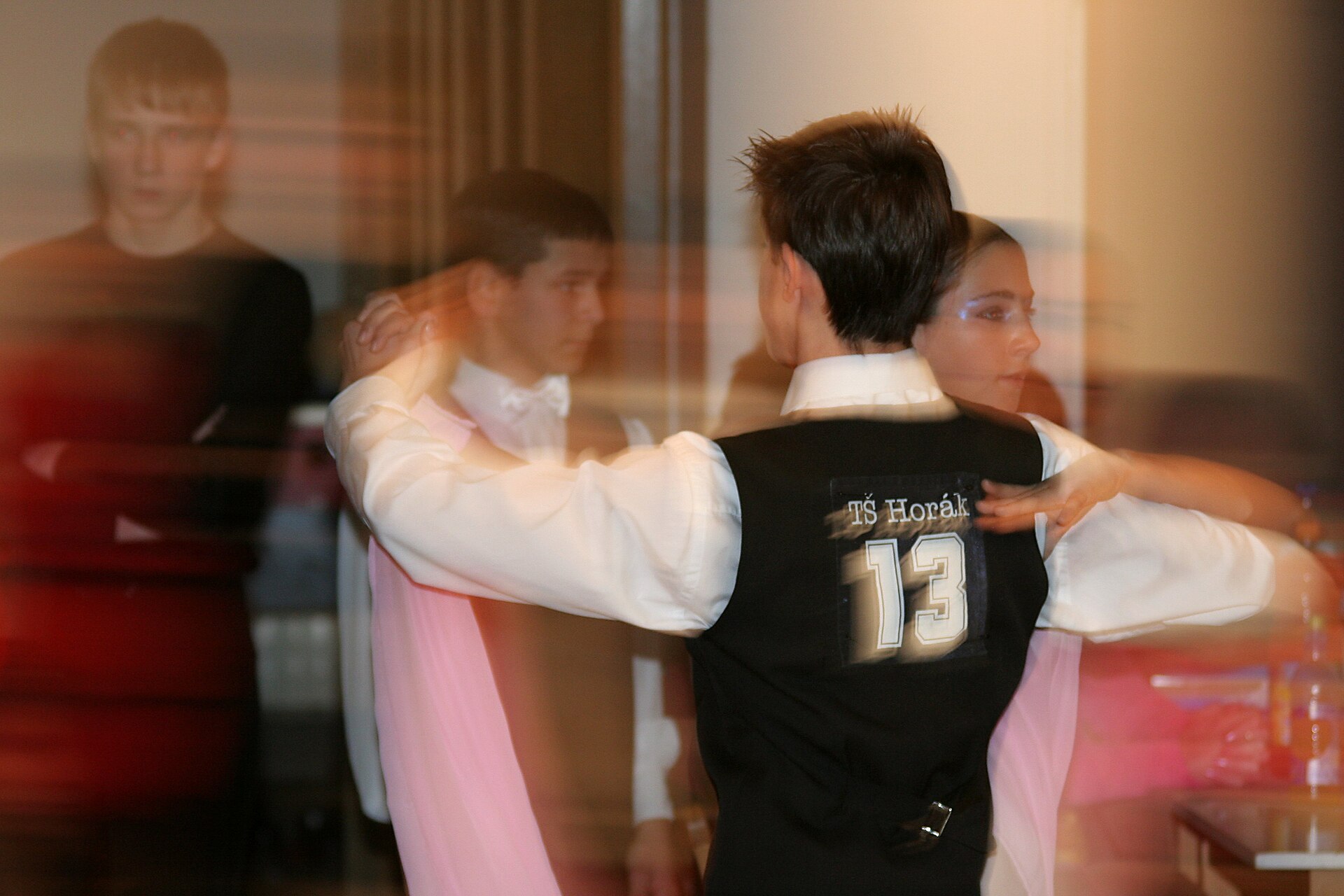 A ballroom dance couple in motion