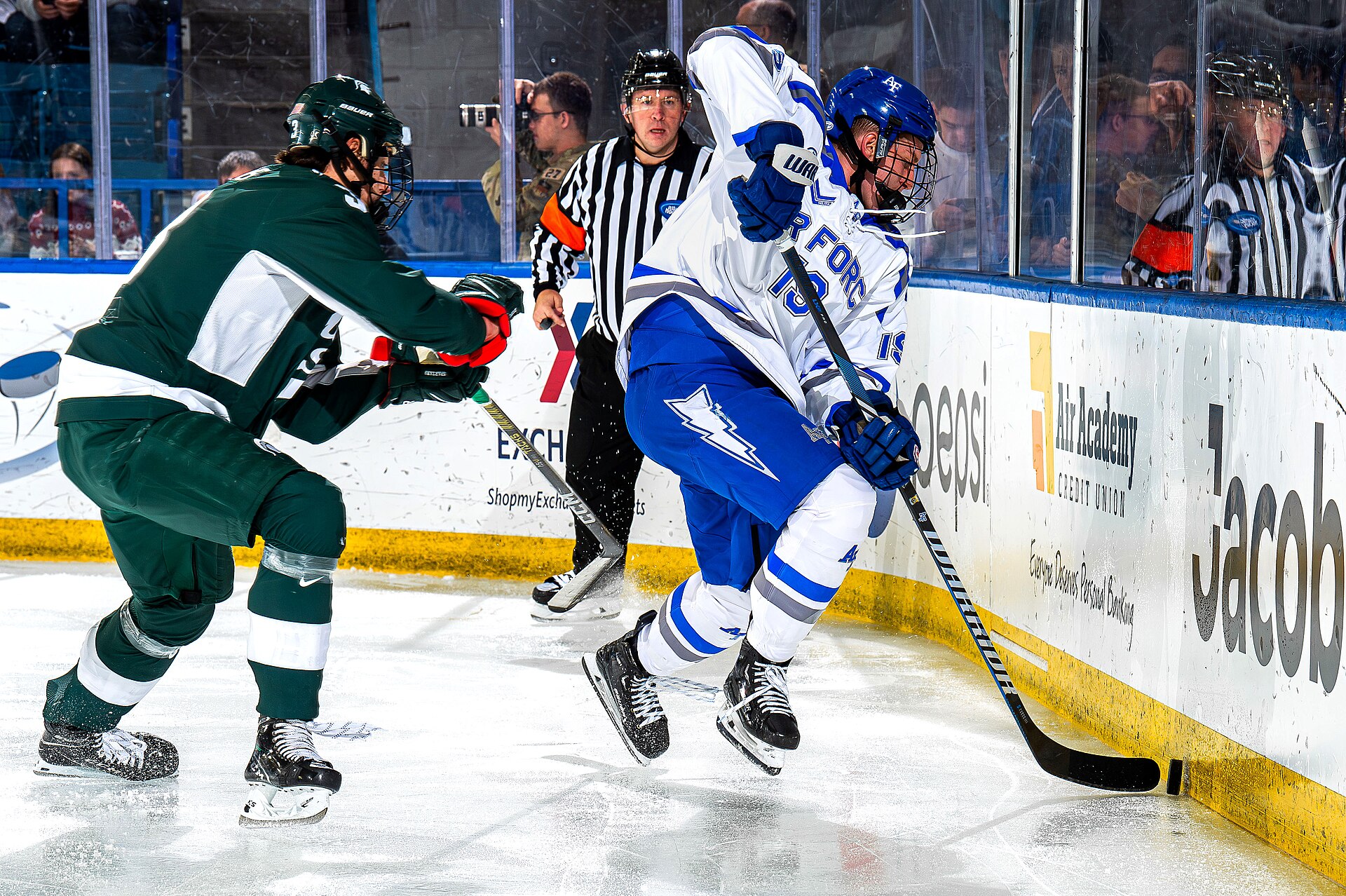 A hockey game in progress at an arena