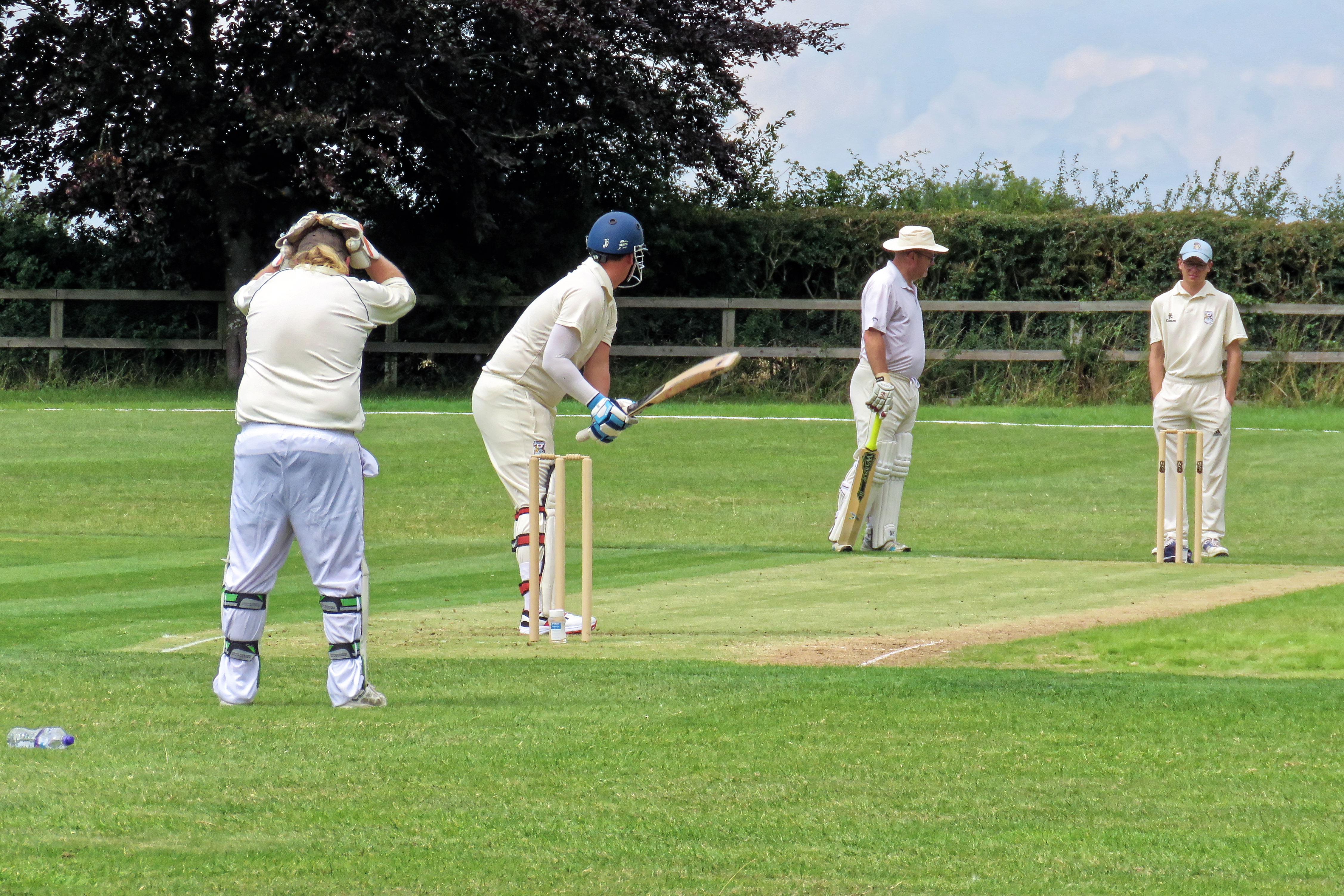 A batter plays a shot during a cricket match