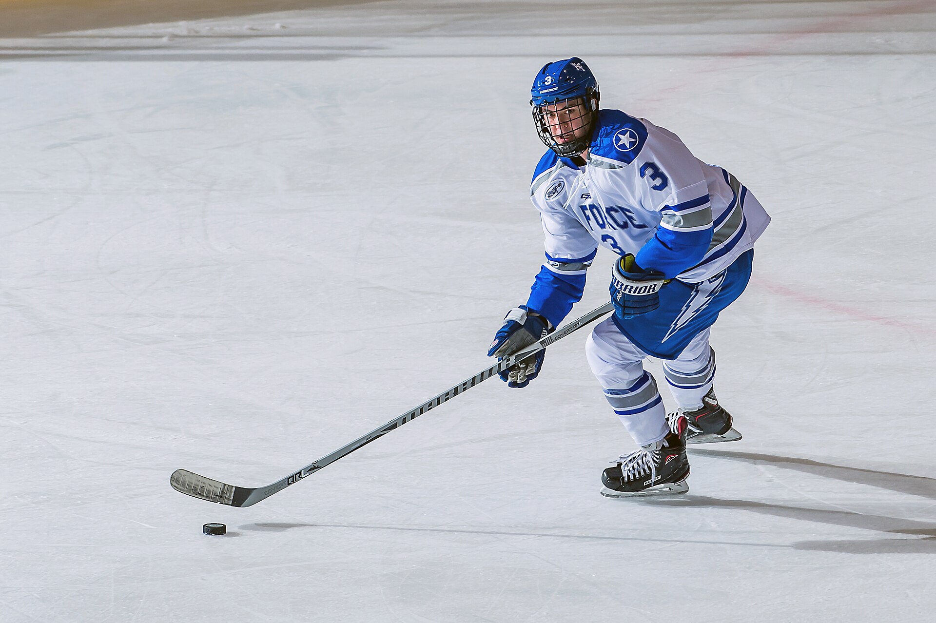 A hockey game in progress at an arena