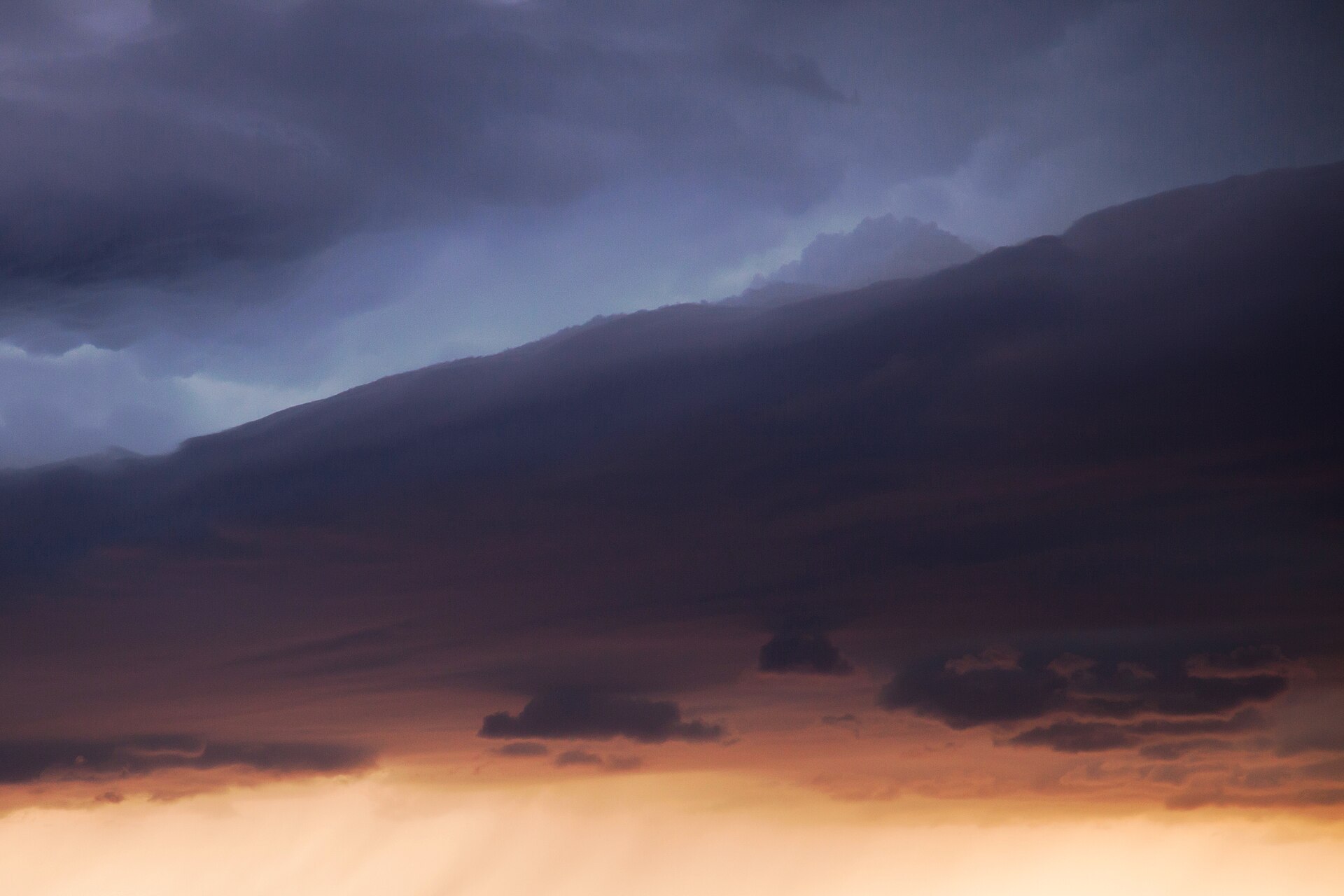 Storm clouds building over flat land