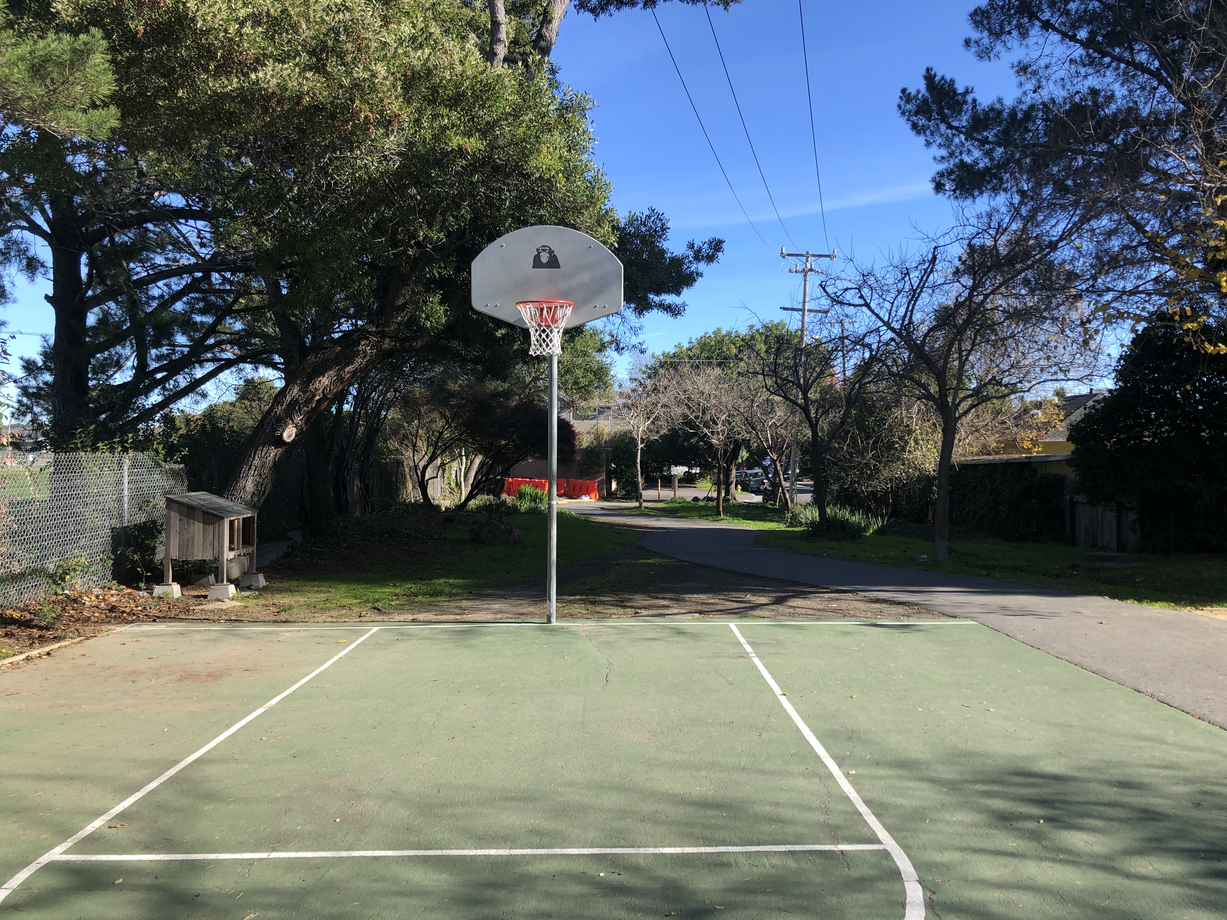 A basketball hoop on an outdoor court
